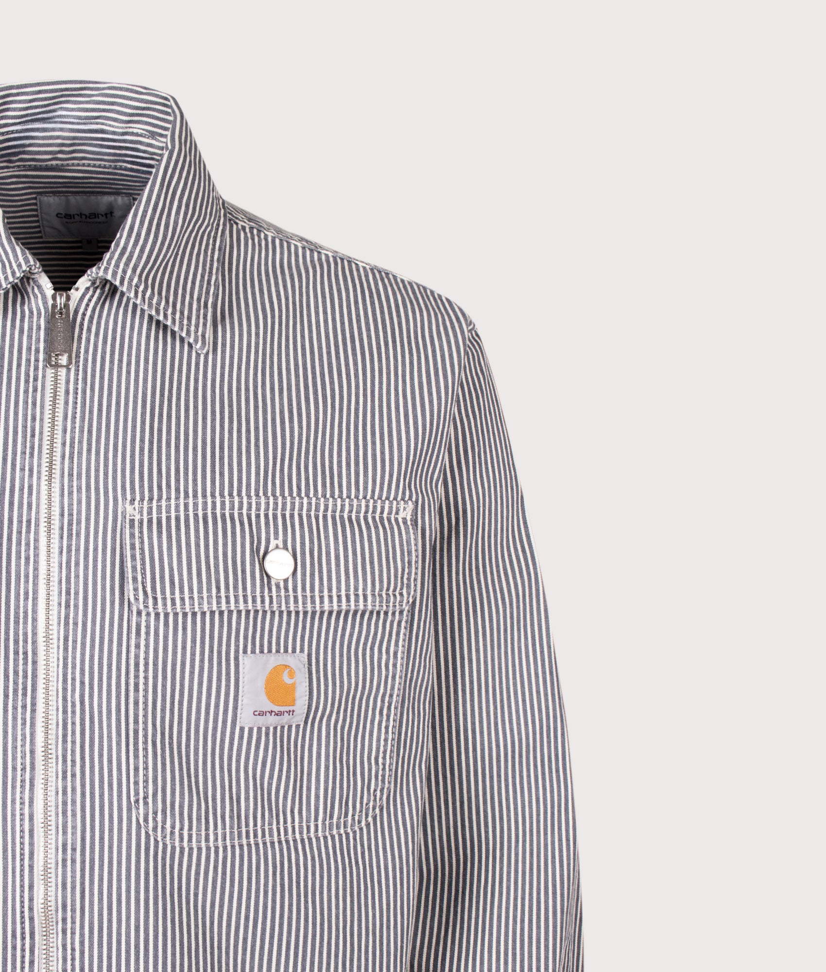 Carhartt WIP Hickory Stripe Mercer Overshirt in Graphite and Wax at EQVVS  Menswear. Detail shot.