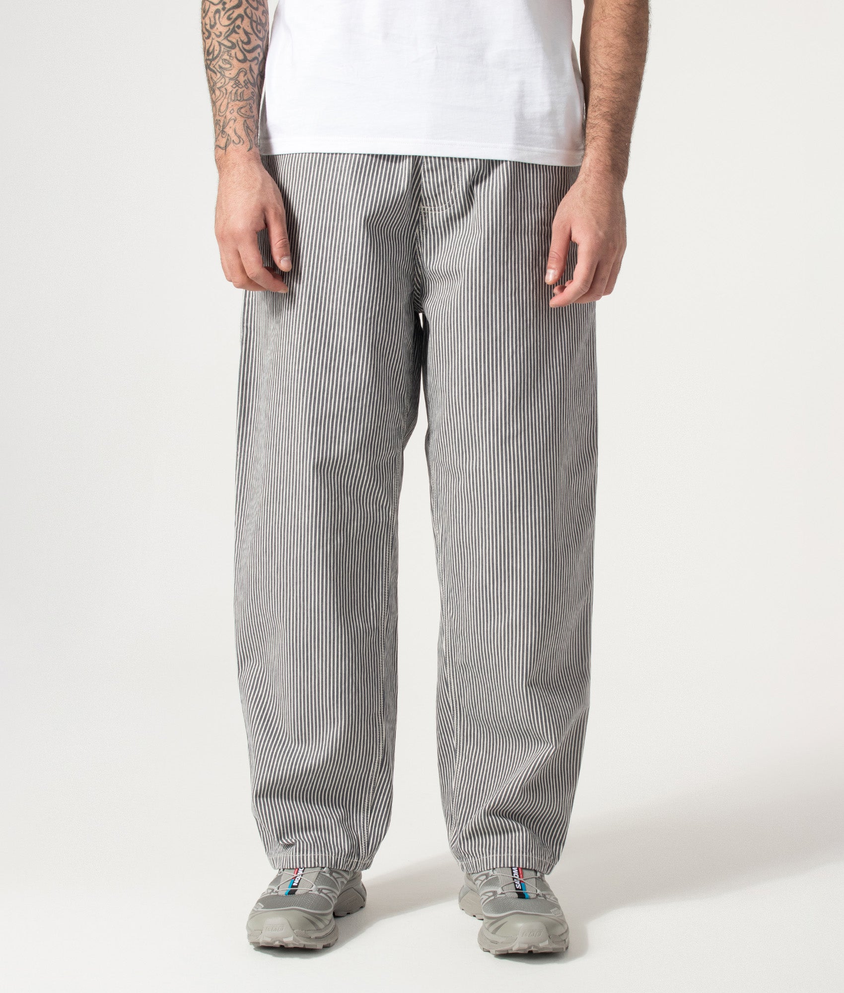 Carhartt WIP Relaxed Fit Mercer Single Knee Pants in Mercer Stripe, Graphite and Wax at EQVVS Menswear. Model front shot.