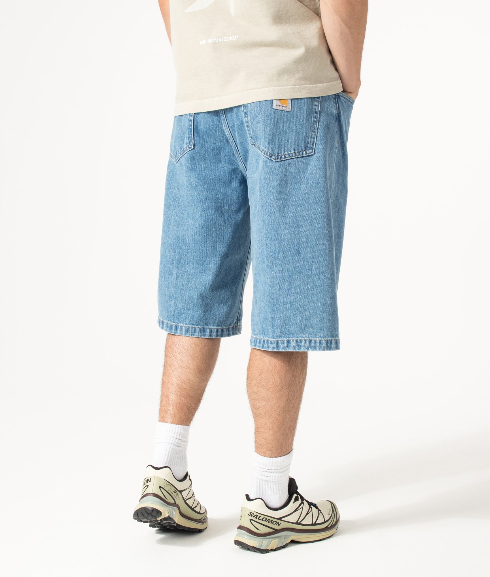 Carhartt WIP Loose Fit Langdon Denim Shorts in Blue at EQVVS Menswear. Angled model back shot.