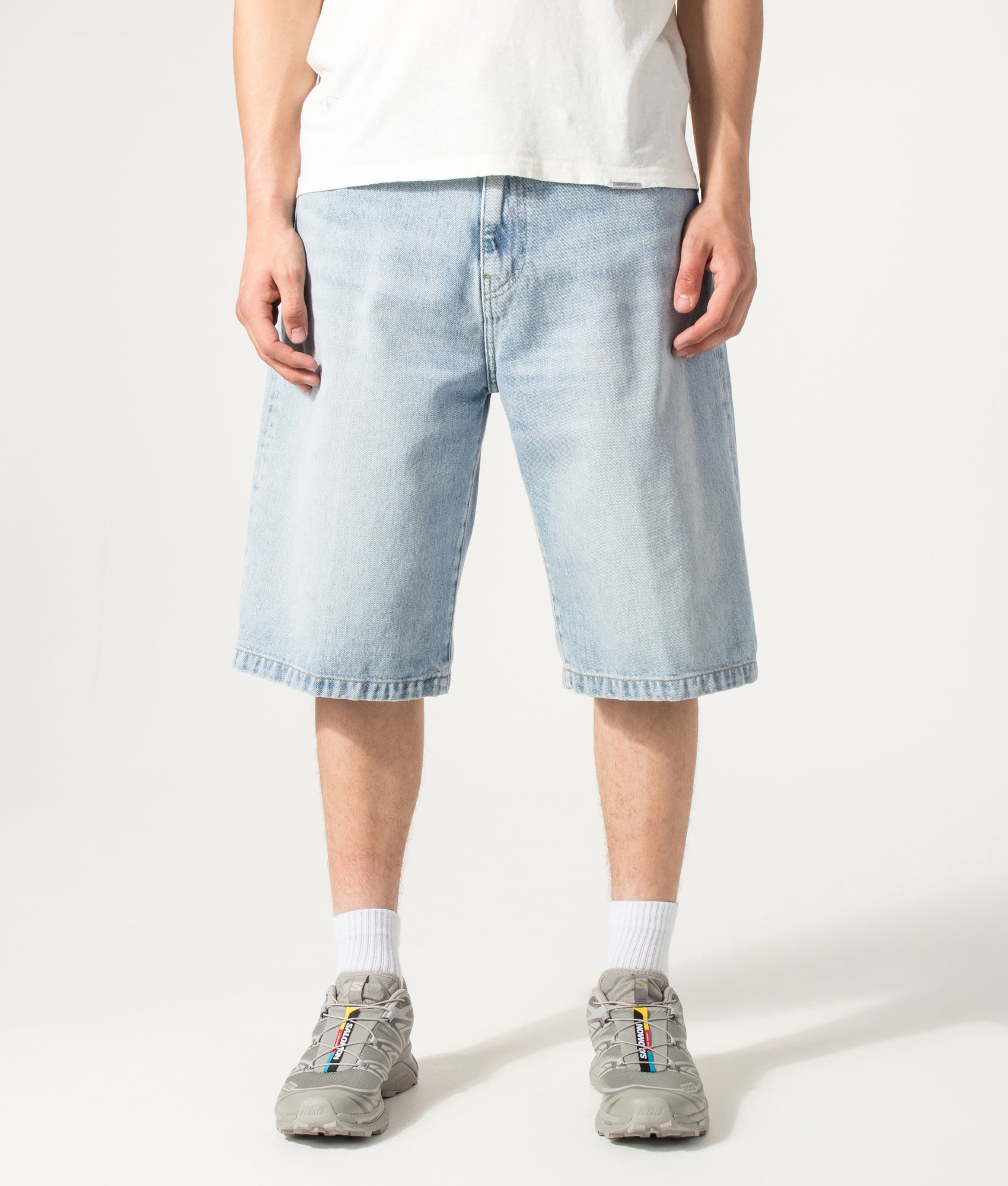 Carhartt WIP Loose Fit Langdon Denim Shorts in Heavy Worn Bleached Blue at EQVVS Menswear. Model front shot.