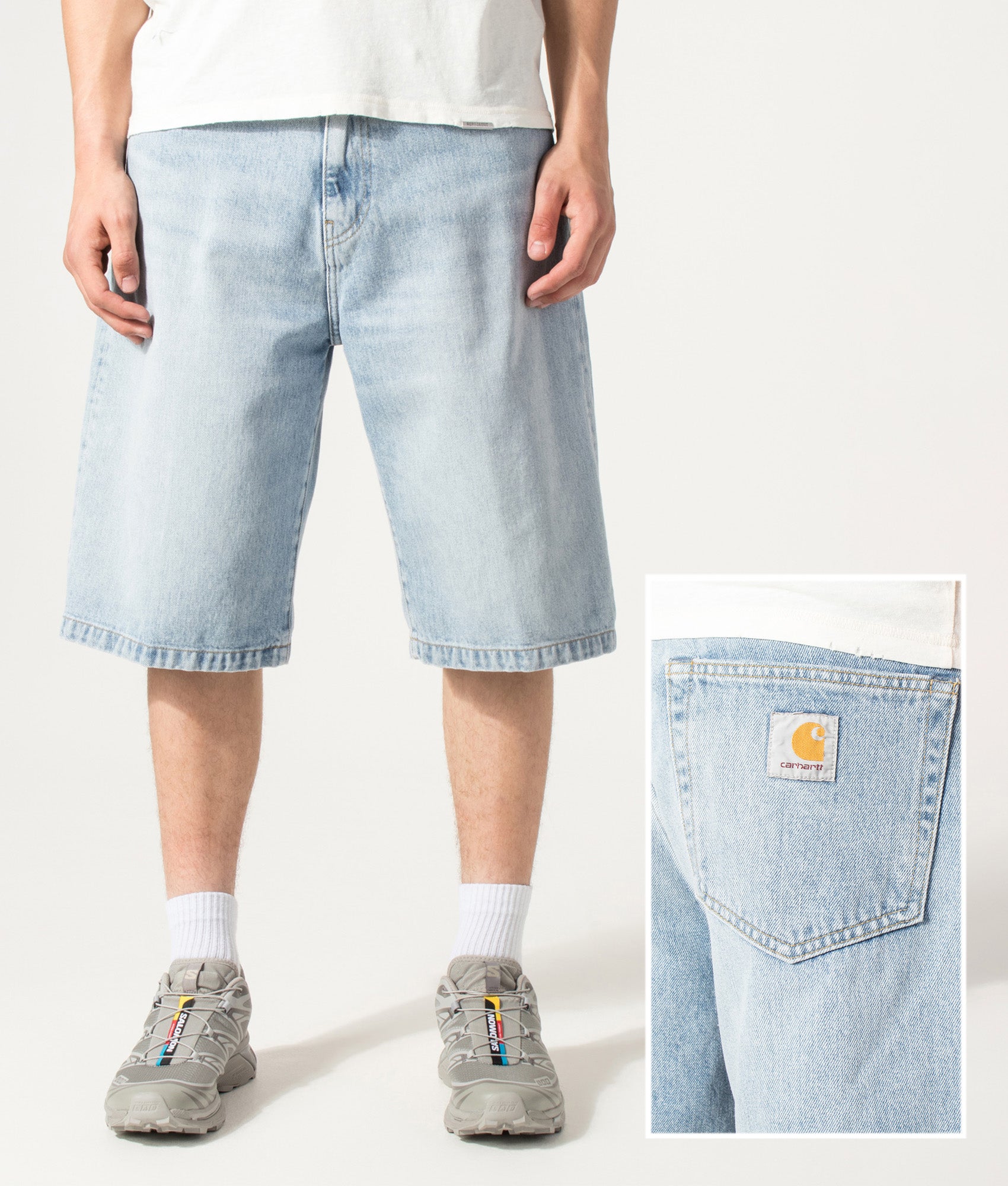 Carhartt WIP Loose Fit Langdon Denim Shorts in Heavy Worn Bleached Blue at EQVVS Menswear. Model front shot and back detail shot.