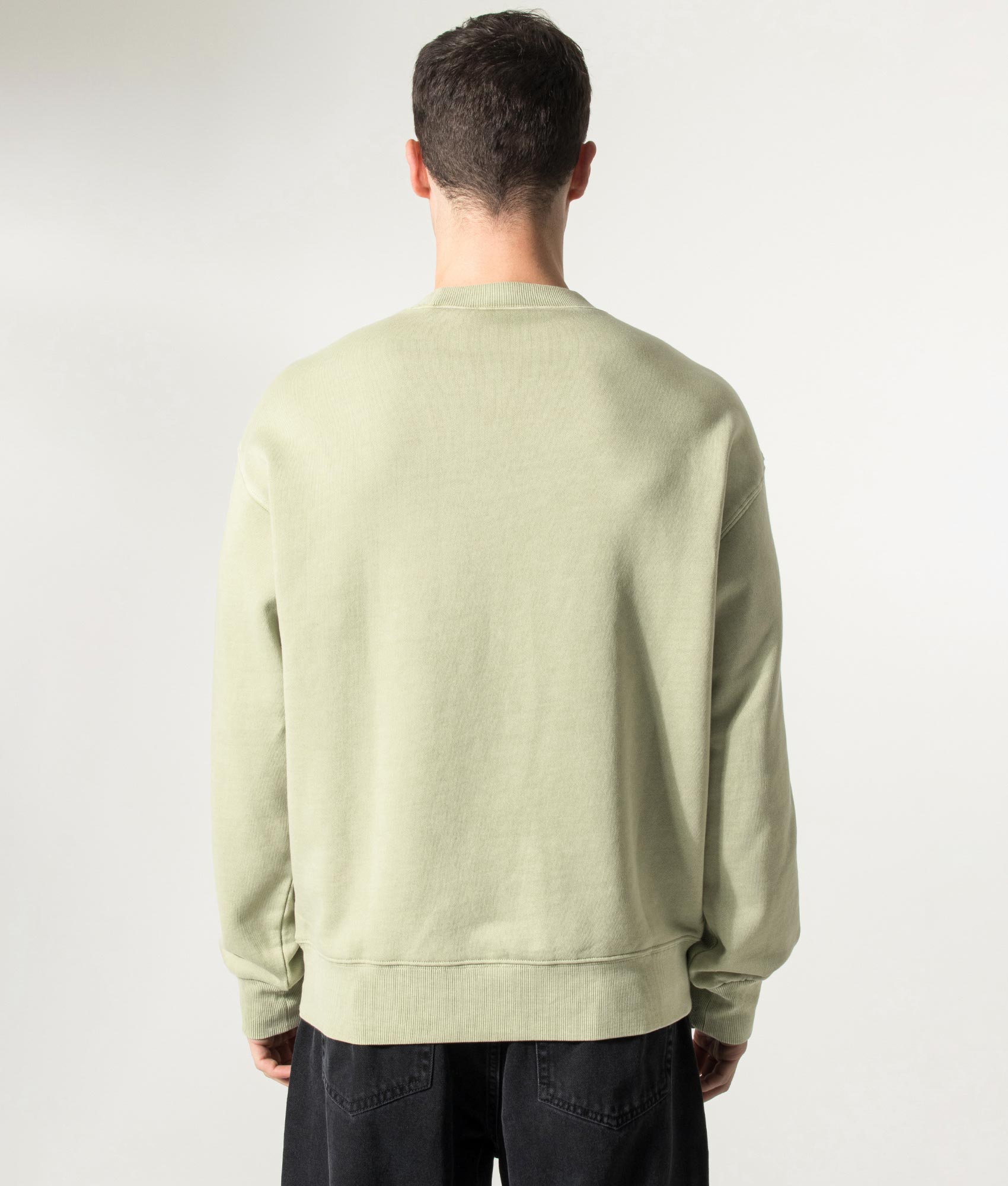 Carhartt WIP Oversized Nelson Sweatshirt in Gentle Green at EQVVS Menswear. Model back shot.