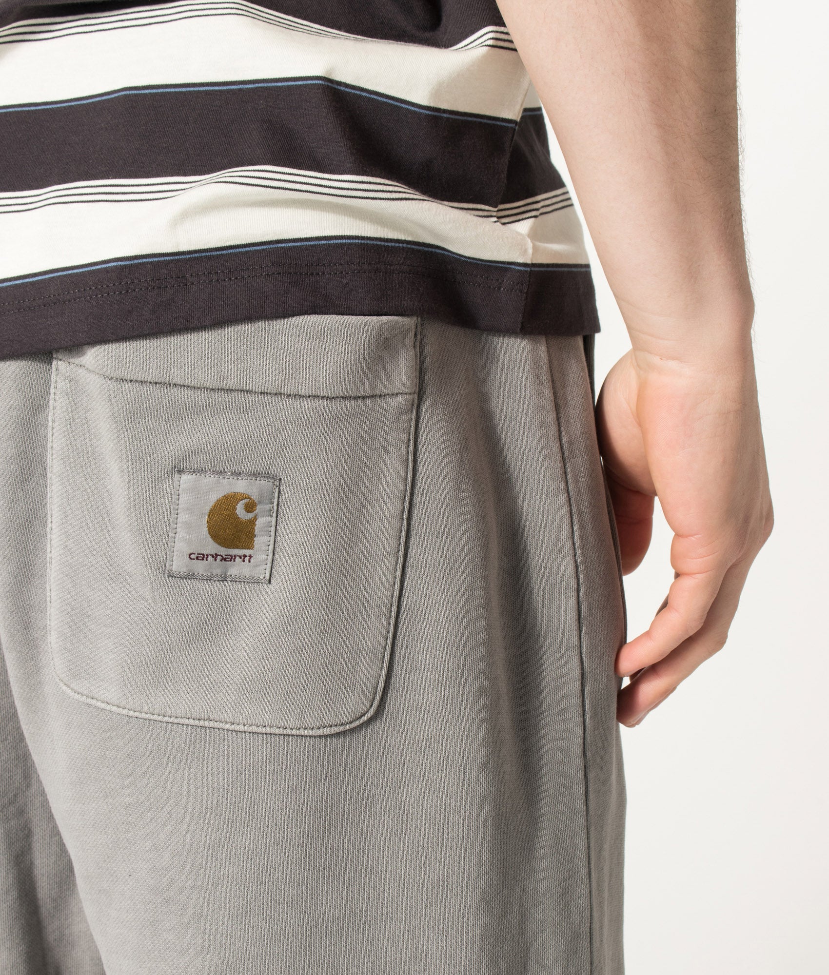 Carhartt WIP Balloon Fit Nelson Sweat Shorts in Yosemite at EQVVS Menswear. Detail shot.
