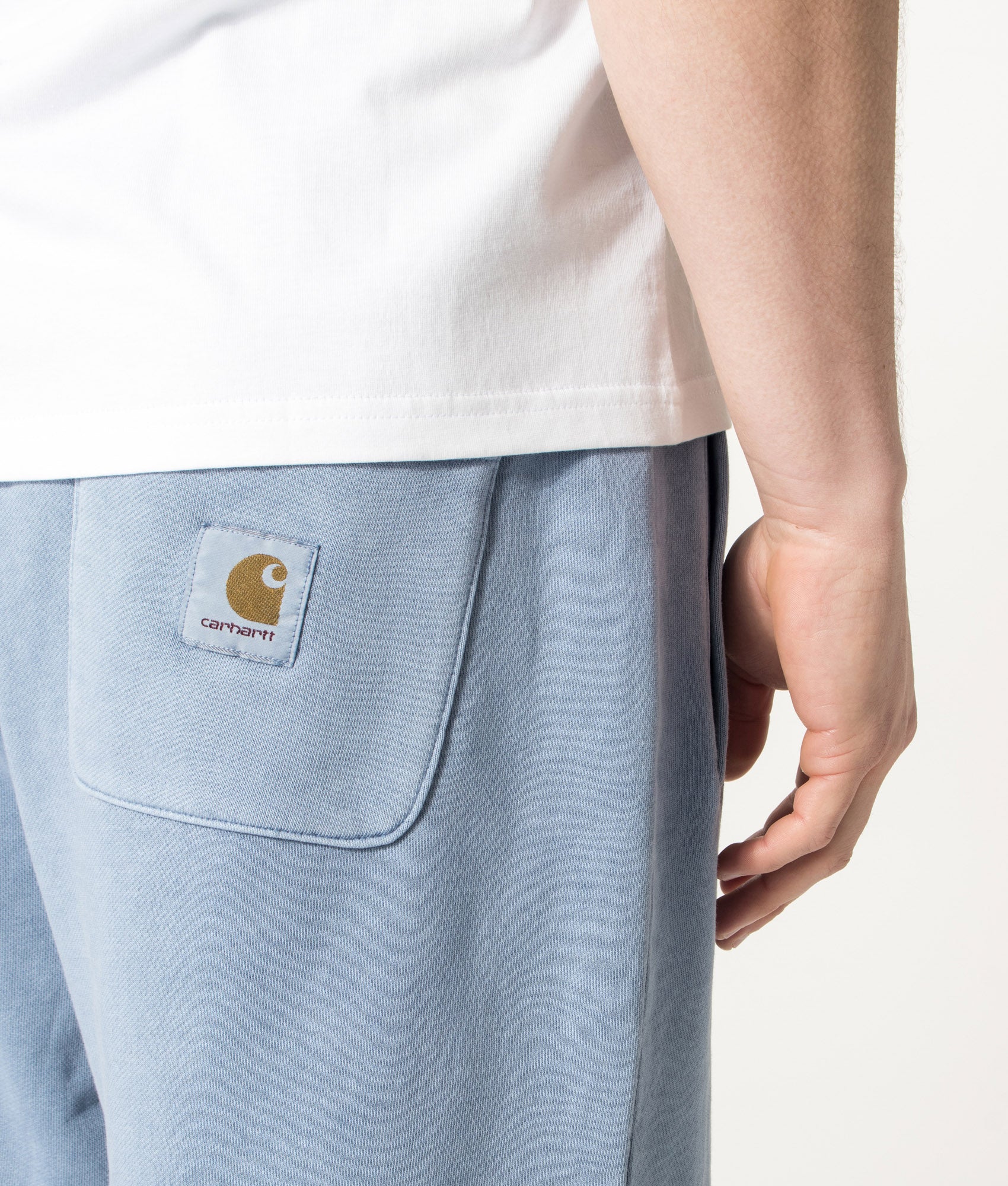 Carhartt WIP Balloon Fit Nelson Sweat Shorts in Gentle Blue at EQVVS Menswear. Detail shot.