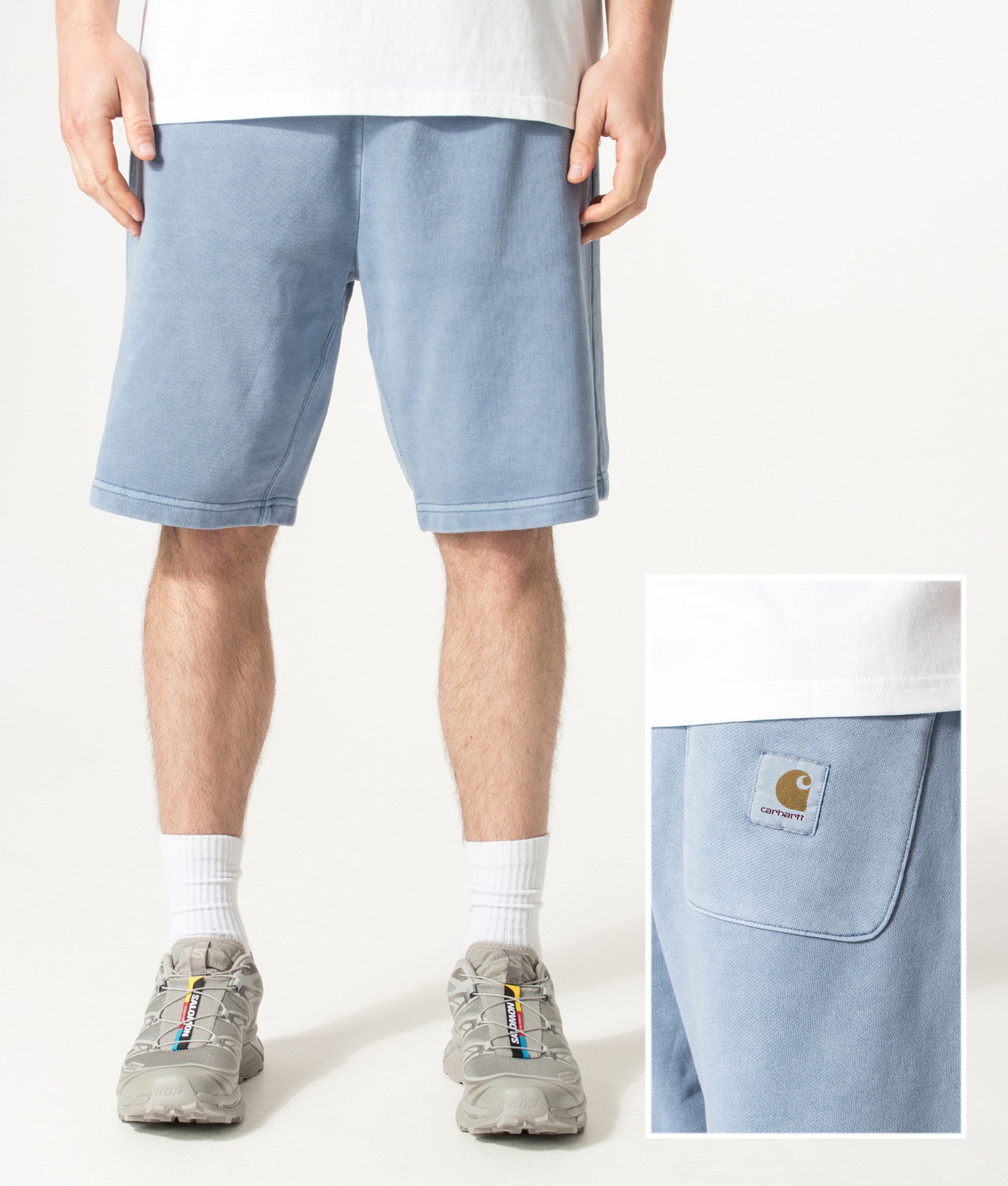 Carhartt WIP Balloon Fit Nelson Sweat Shorts in Gentle Blue at EQVVS Menswear. Front and back shot.