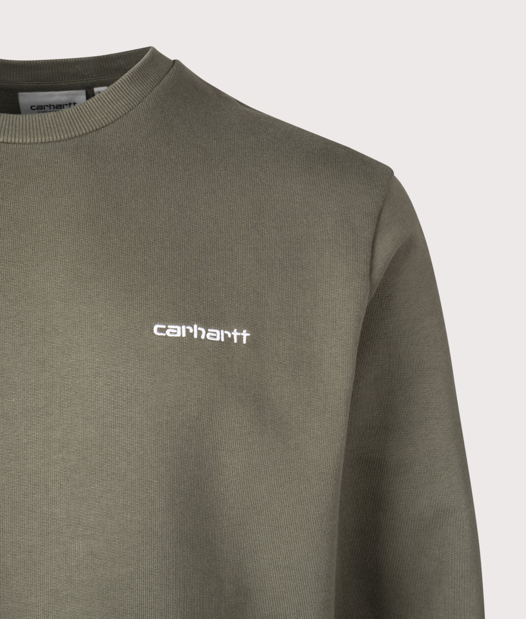 Carhartt WIP Script Embroidery Sweatshirt in Leaf and White at EQVVS Menswear. Detail shot.