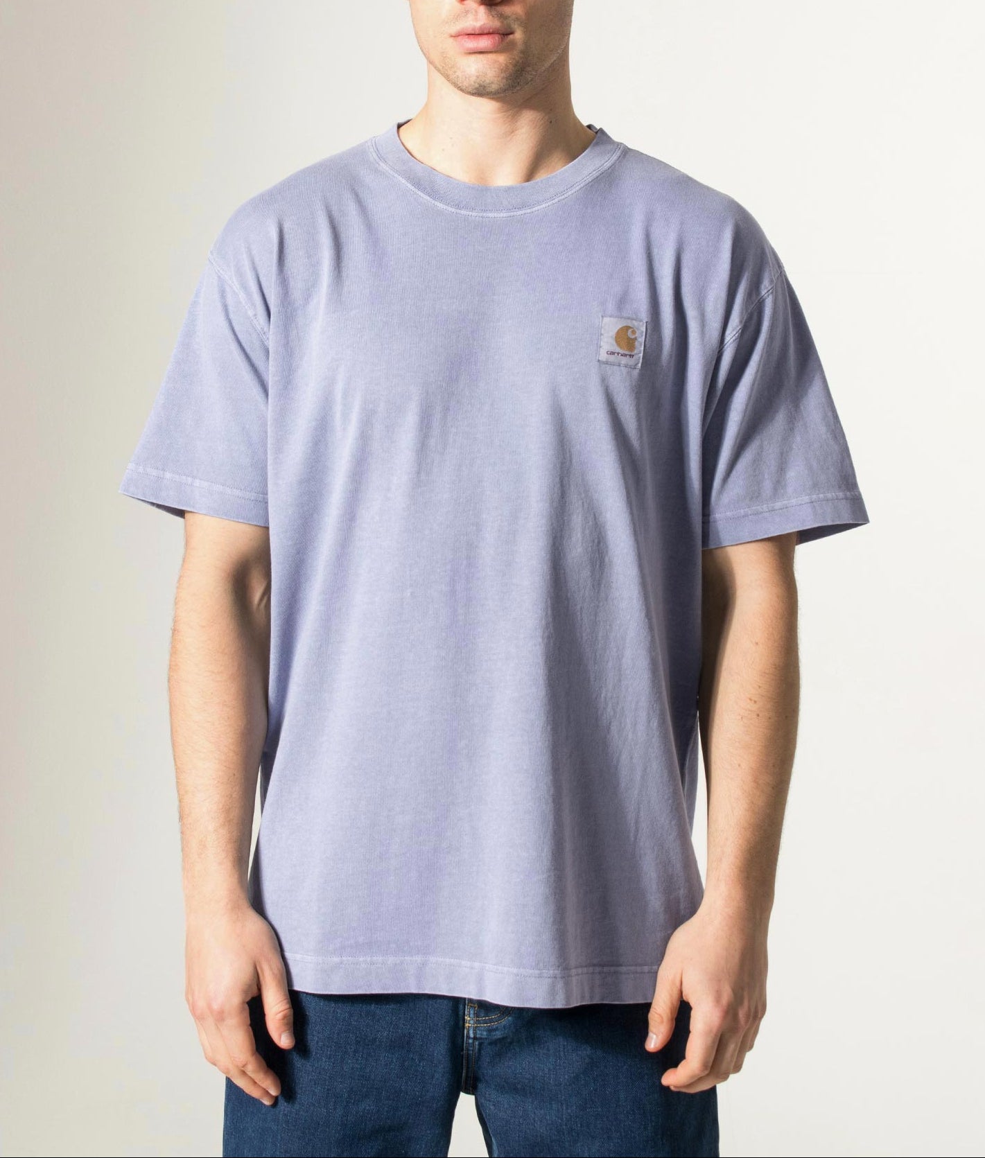 Carhartt WIP Relaxed Fit Nelson T-Shirt in Gentle Blue at EQVVS Menswear. Model front shot.
