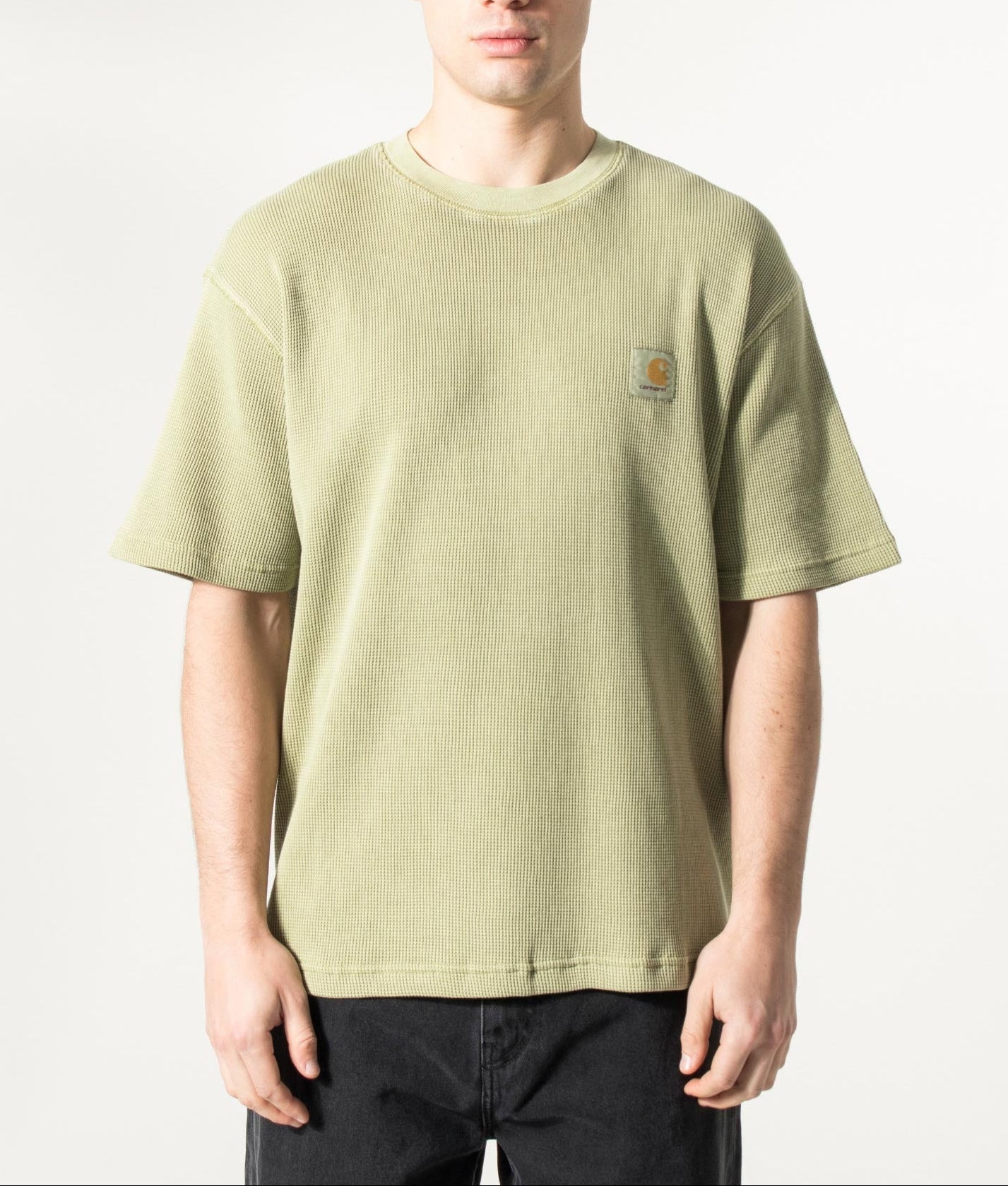 Carhartt WIP Relaxed Fit Nelson Waffle T-Shirt in Gentle Green at EQVVS Menswear. Model front shot.