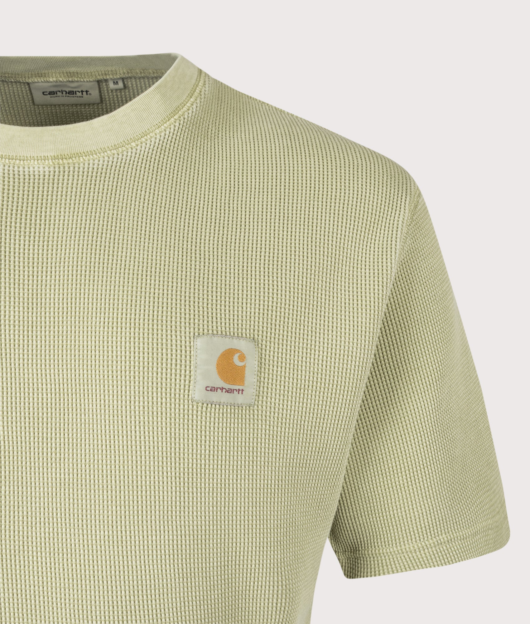 Carhartt WIP Relaxed Fit Nelson Waffle T-Shirt in Gentle Green at EQVVS Menswear. Detail shot.