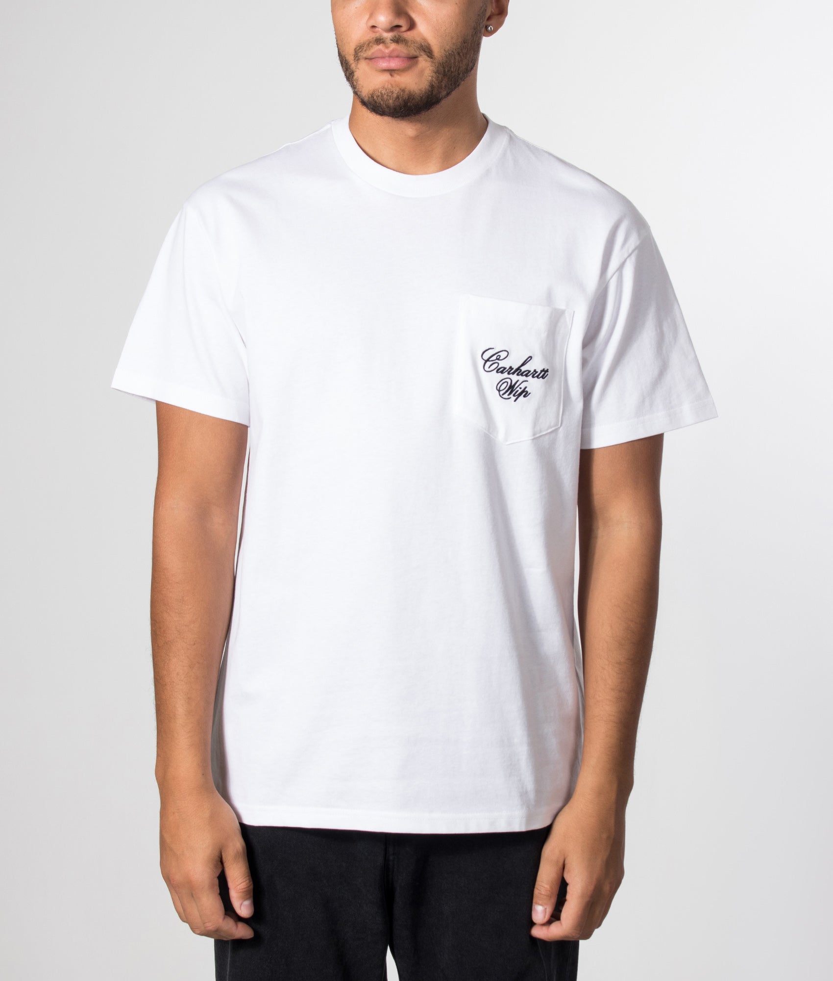 Carhartt WIP Loose Fit Longhand Pocket T-Shirt in White and Black at EQVVS Menswear. Model front shot.