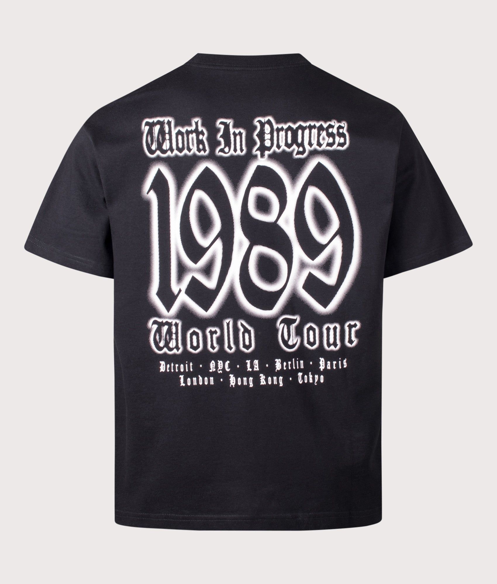 Carhartt WIP Loose Fit World Tour T-Shirt in Black at EQVVS Menswear. Back shot.