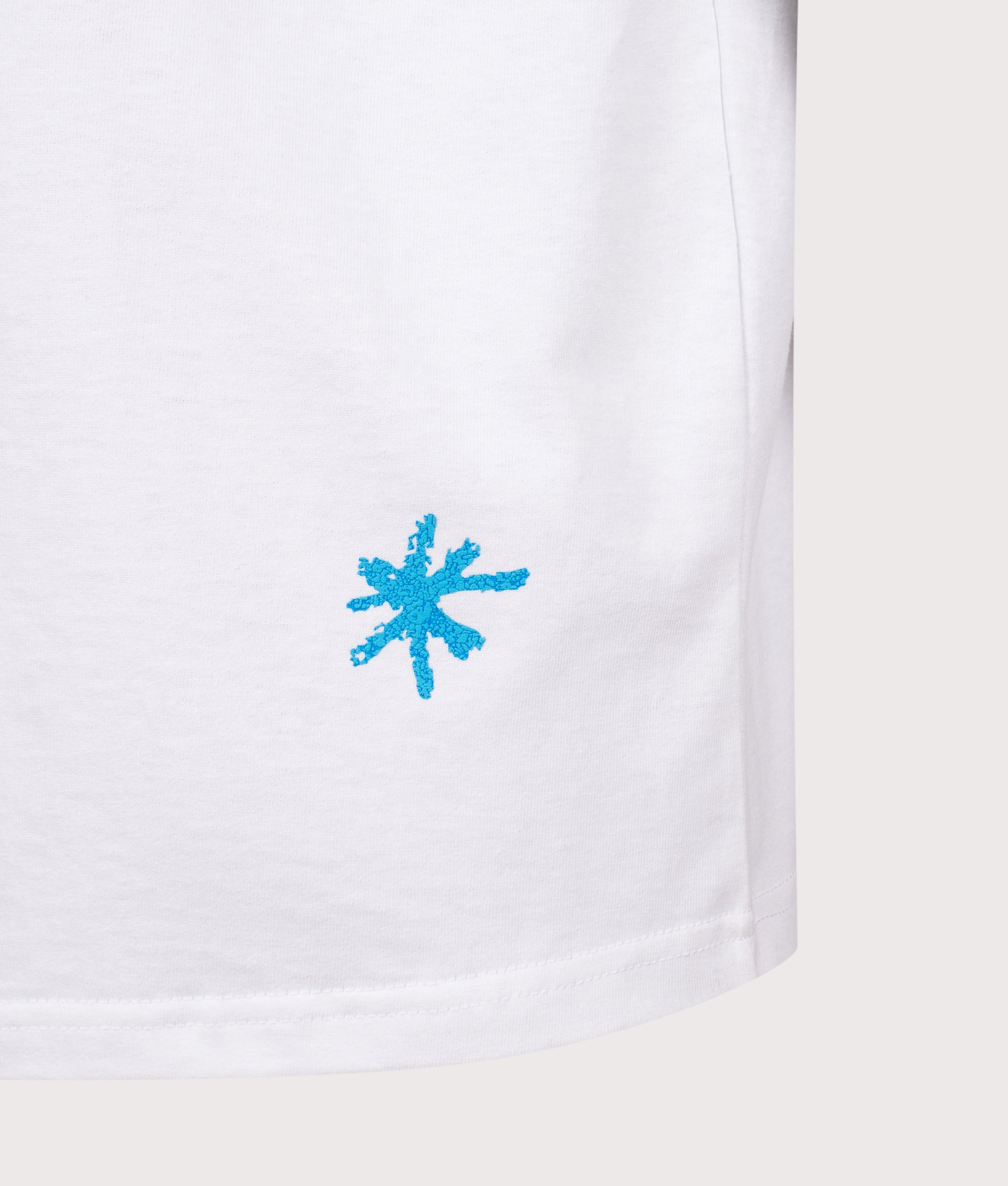 Carhartt WIP Relaxed Fit Primary T-Shirt  in White at EQVVS Menswear. Hem detail shot.