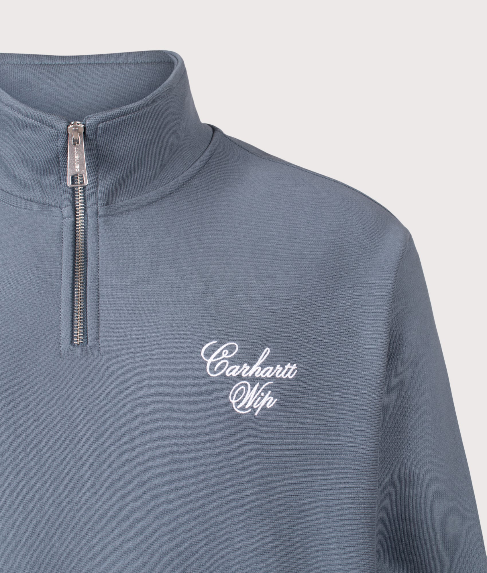 Carhartt WIP Relaxed Fit Longhand Half Zip Sweatshirt in Cozy Blue and White at EQVVS Menswear. Detail shot.
