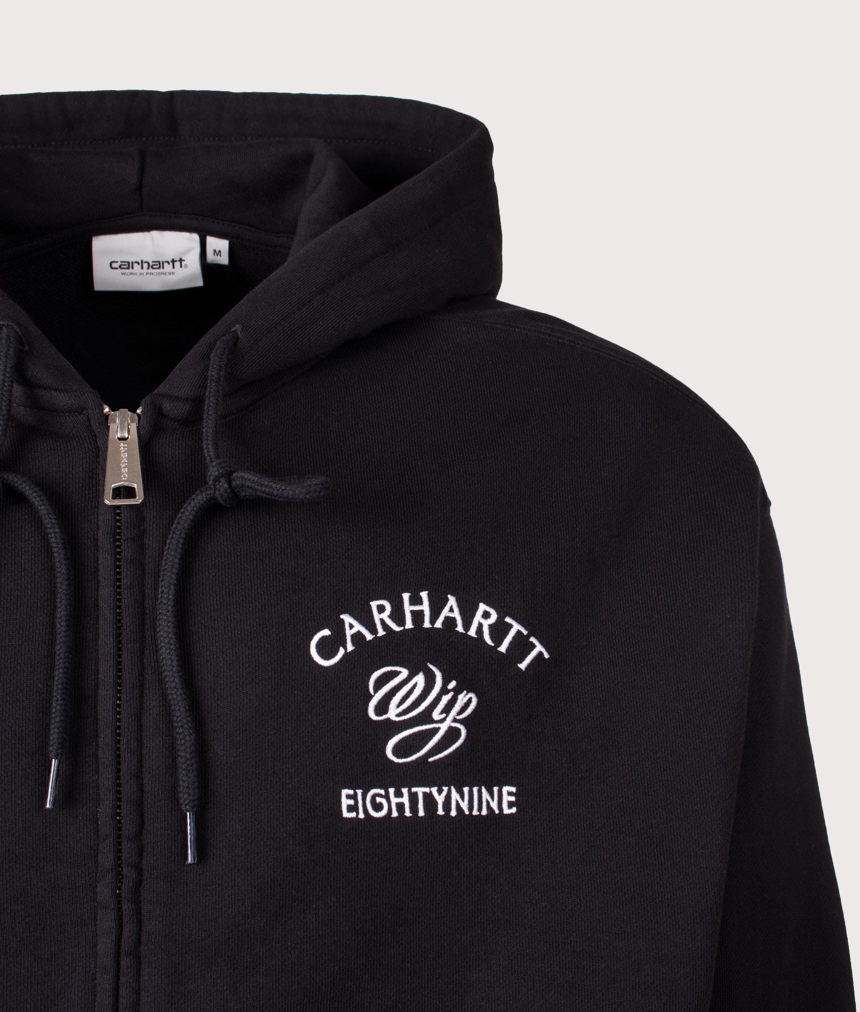Carhartt WIP Oversized Eightynine Hooded Sweat Jacket in Black at EQVVS Menswear. Detail shot.