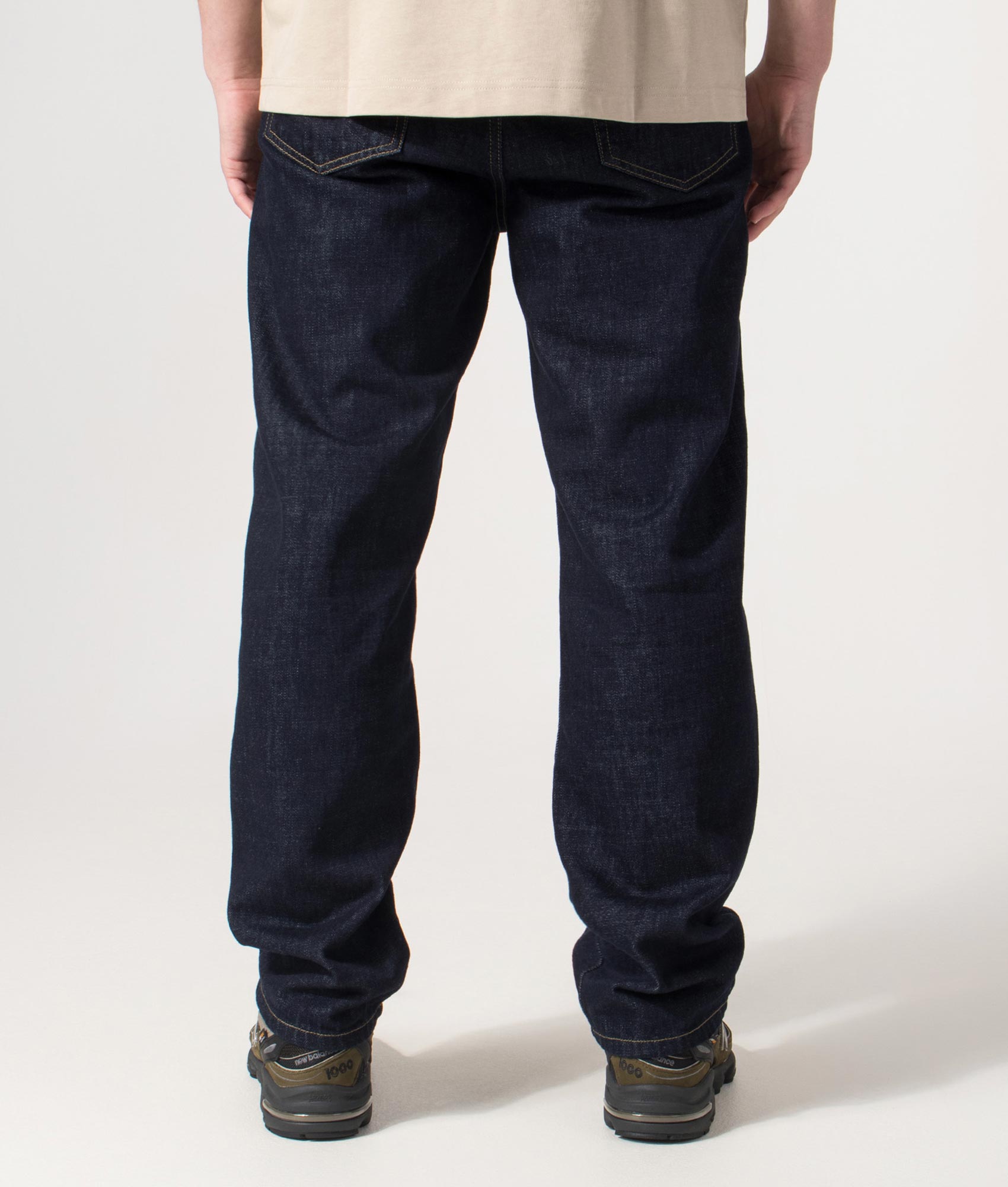 Carhartt WIP Regular Fit Tapered Aaron Pants in Blue at EQVVS Menswear. Back shot.