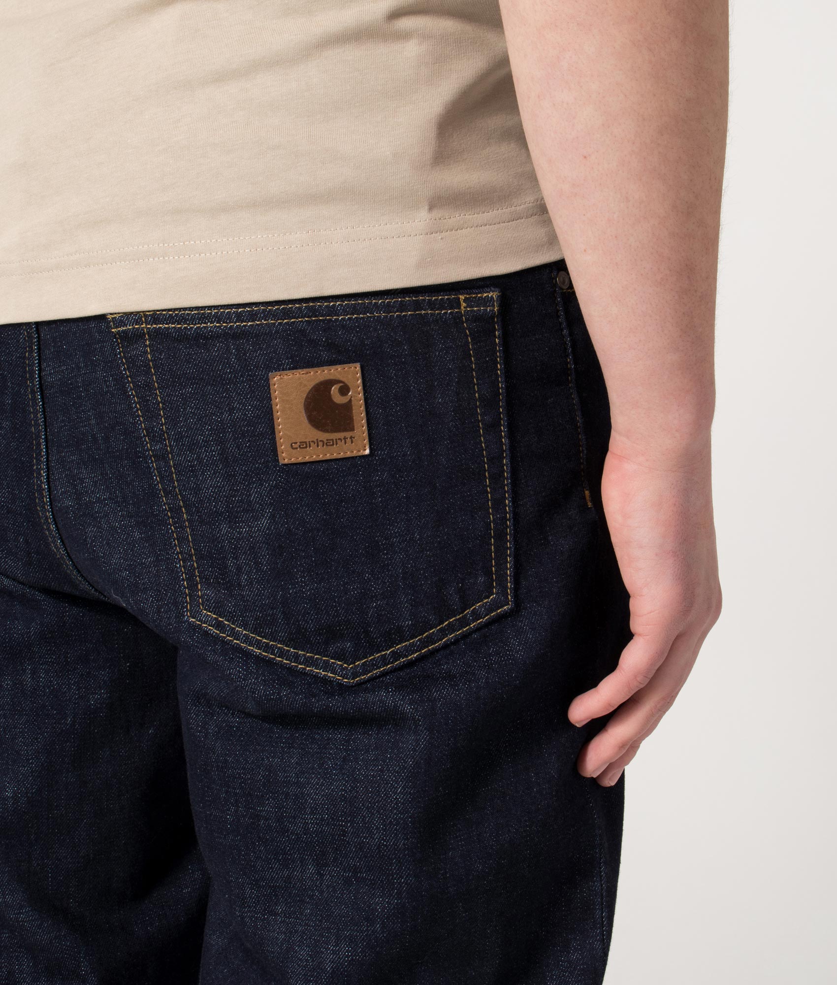 Carhartt WIP Regular Fit Tapered Aaron Pants in Blue at EQVVS Menswear. Back detail shot.