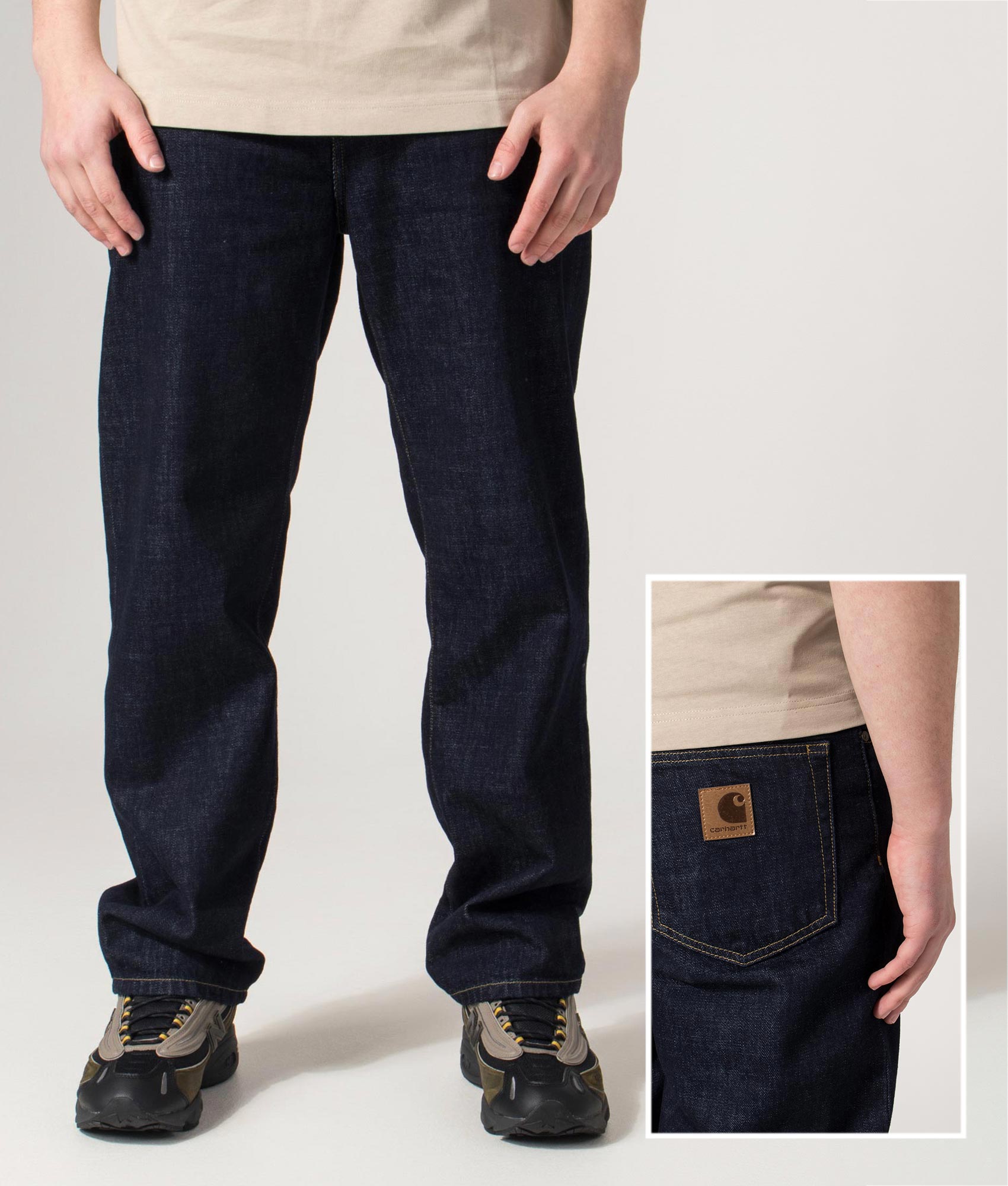 Carhartt WIP Regular Fit Tapered Aaron Pants in Blue at EQVVS Menswear. Front and back detail shot.