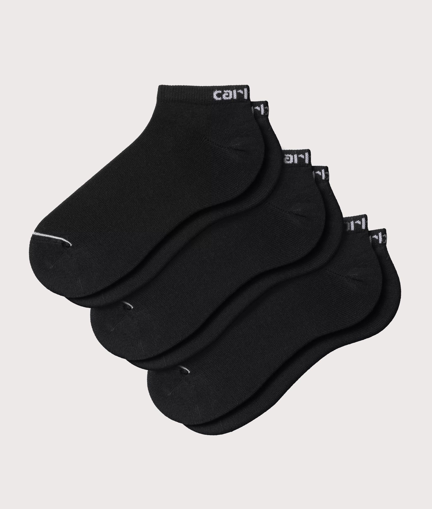 Carhartt WIP Script Sneaker Socks in Black and White at EQVVS Menswear. Front shot.