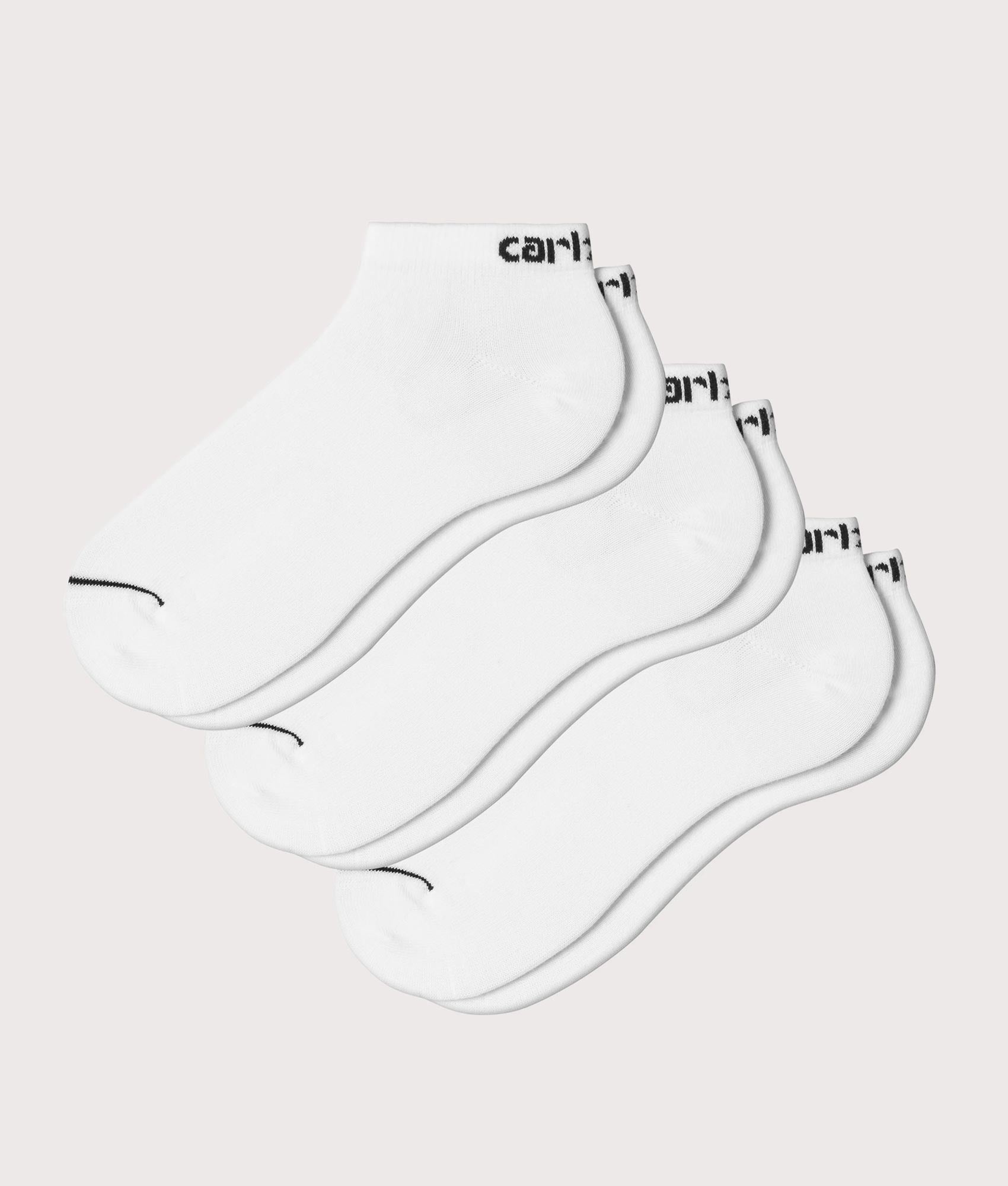 Carhartt WIP Script Sneaker Socks in White and Black at EQVVS Menswear. Front shot.