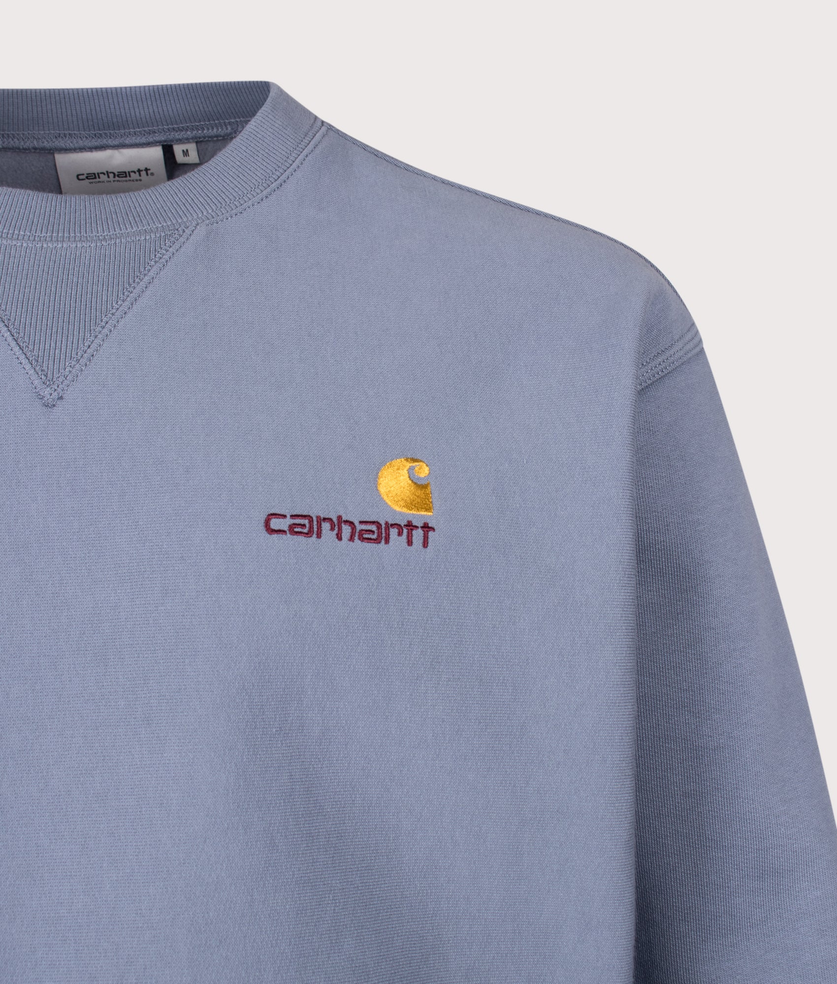 Carhartt WIP Loose Fit American Script Sweatshirt in Shady Blue at EQVVS Menswear. Detail shot.