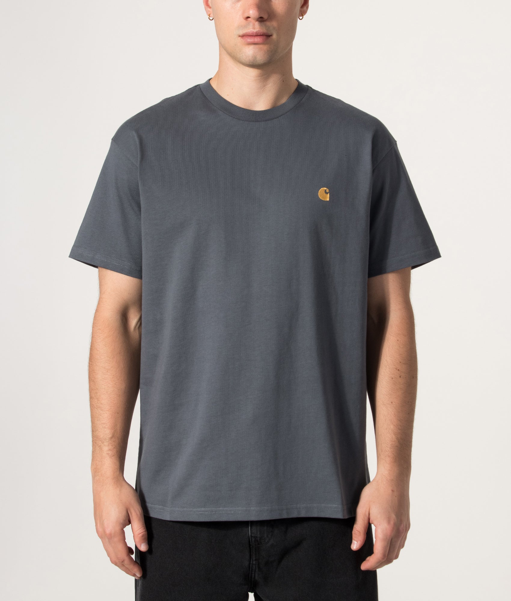Carhartt WIP release the Loose Fit Chase T-Shirt in Styx and Gold at EQVVS Menswear. Model front shot.