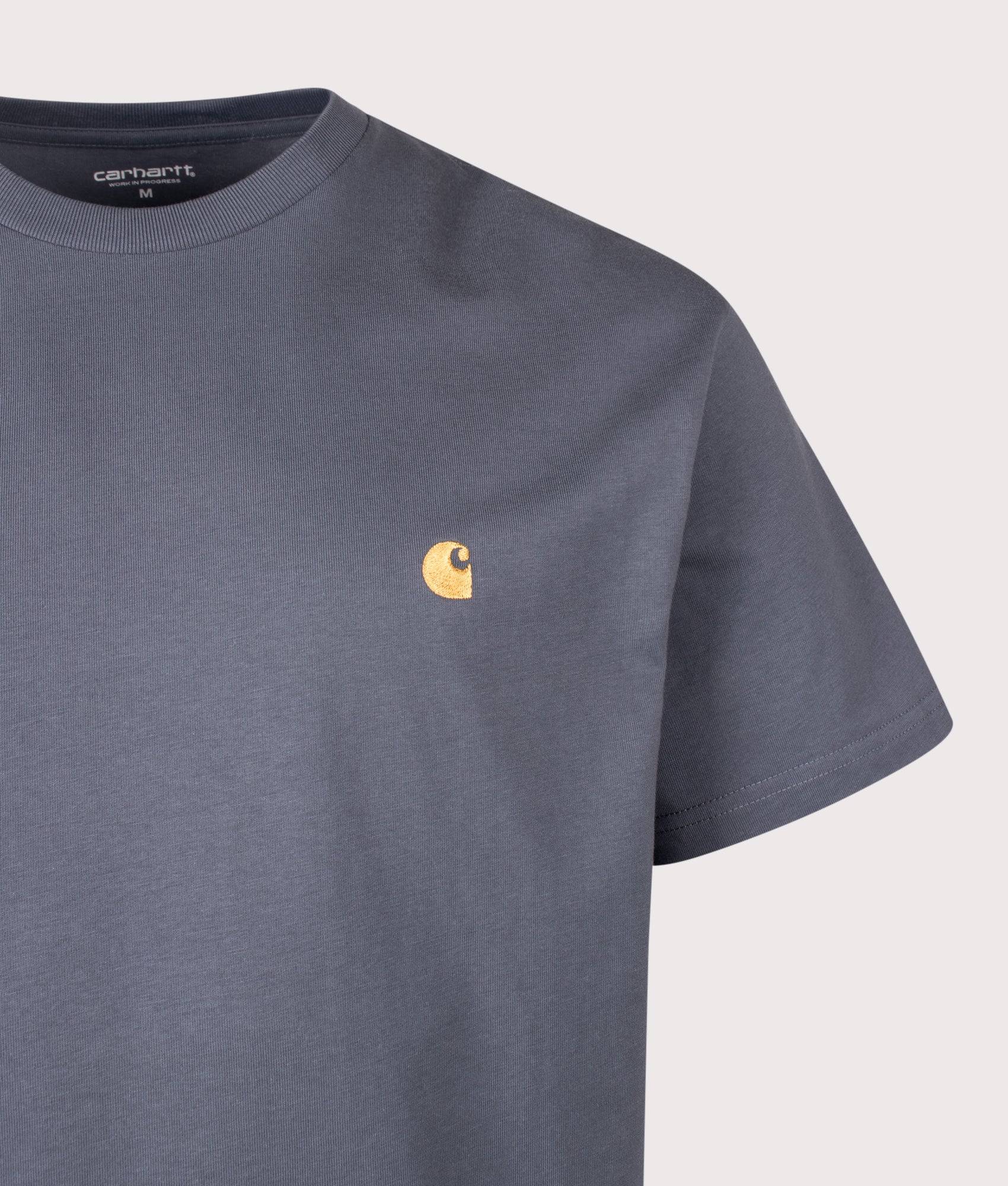 Carhartt WIP release the Loose Fit Chase T-Shirt in Styx and Gold at EQVVS Menswear. Detail shot.