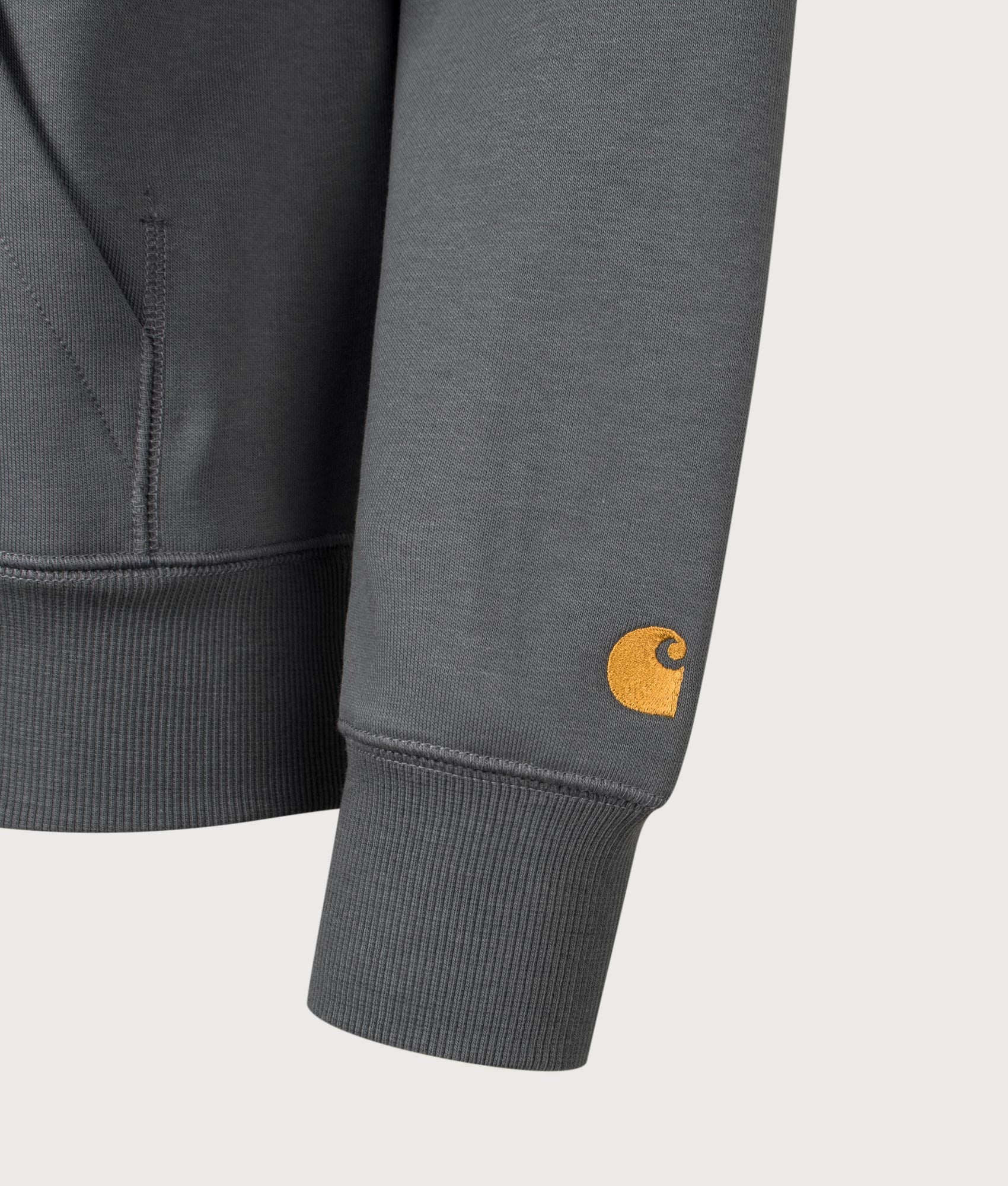Carhartt WIP Chase Hoodie in Styx and Gold at EQVVS Menswear. Detail shot.