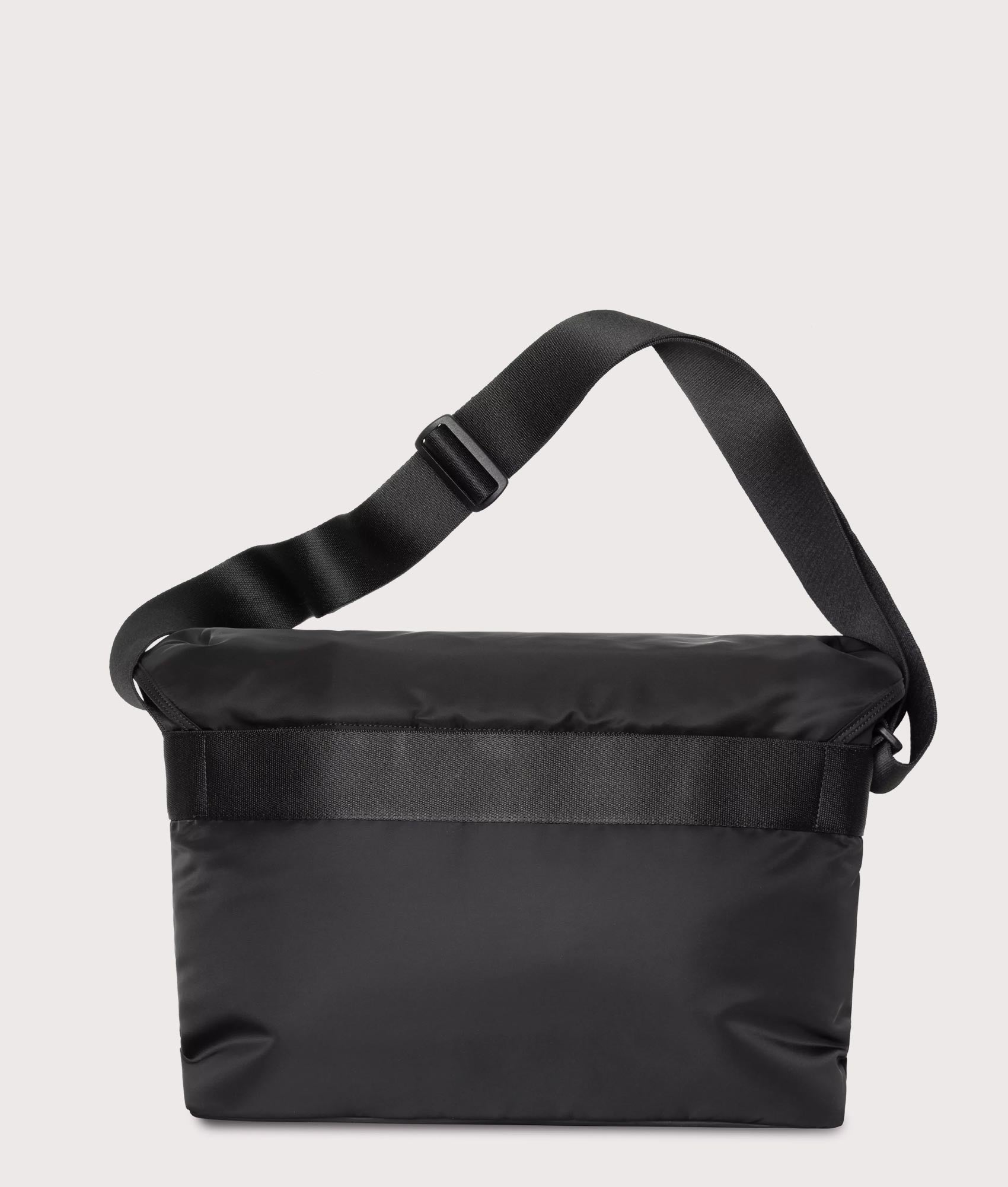 Carhartt WIP Otis Messenger Bag in  Black at EQVVS Menswear. Back shot.