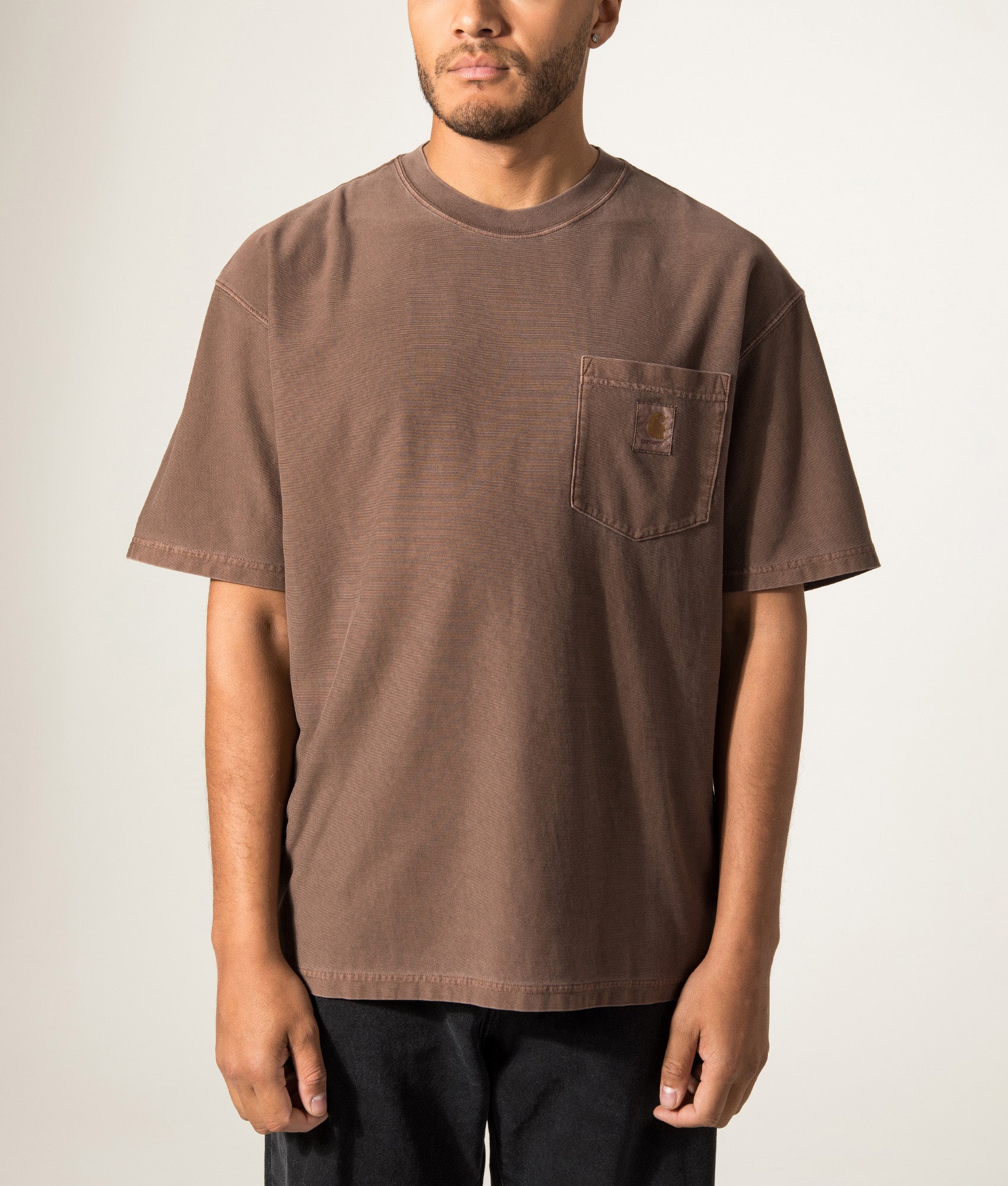 Carhartt WIP Oversized Fit Pocket T-Shirt in Tobacco at EQVVS Menswear. Model front shot.