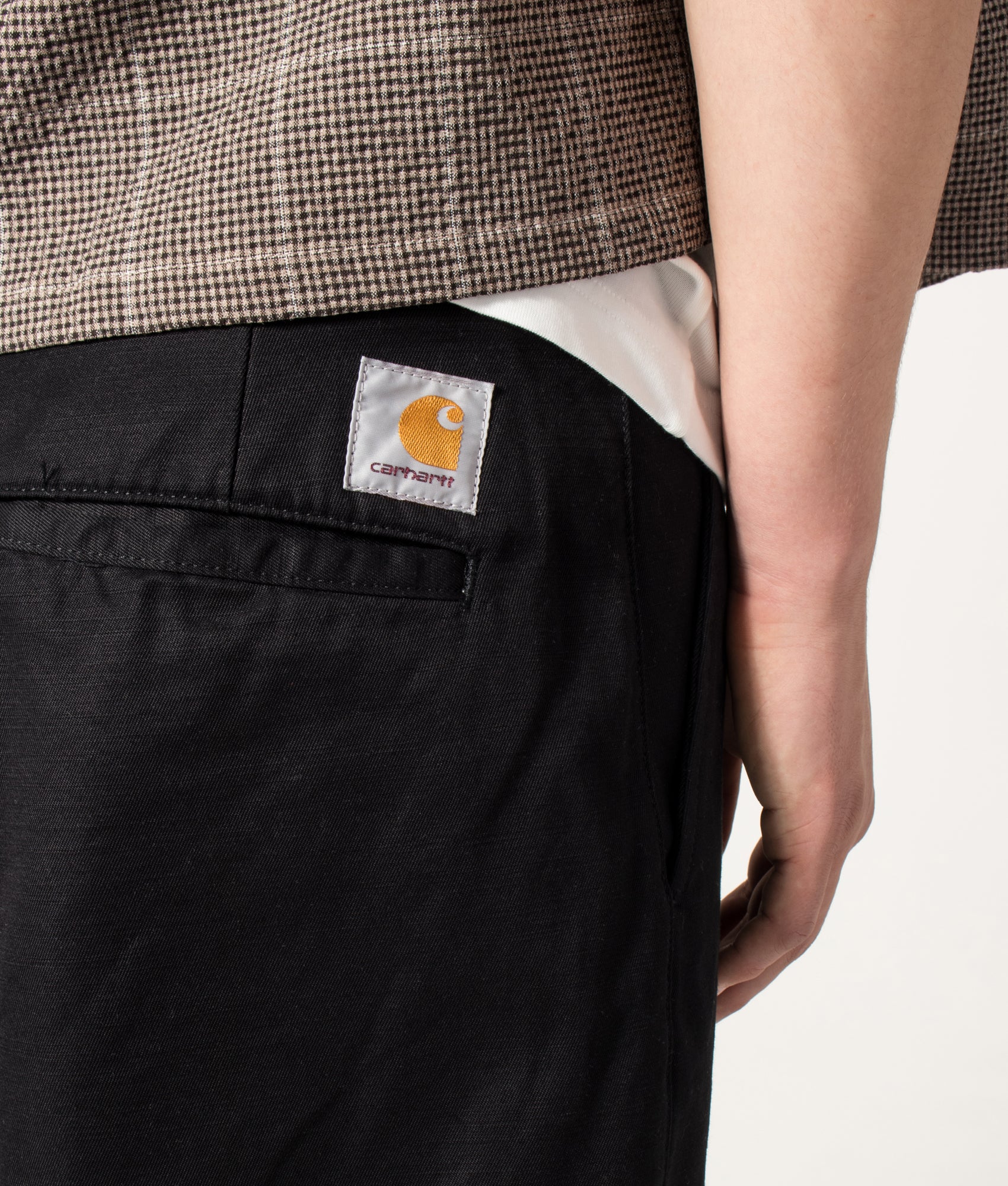 Carhartt WIP Loose Fit Brader Shorts in Black at EQVVS Menswear. Back detail shot.