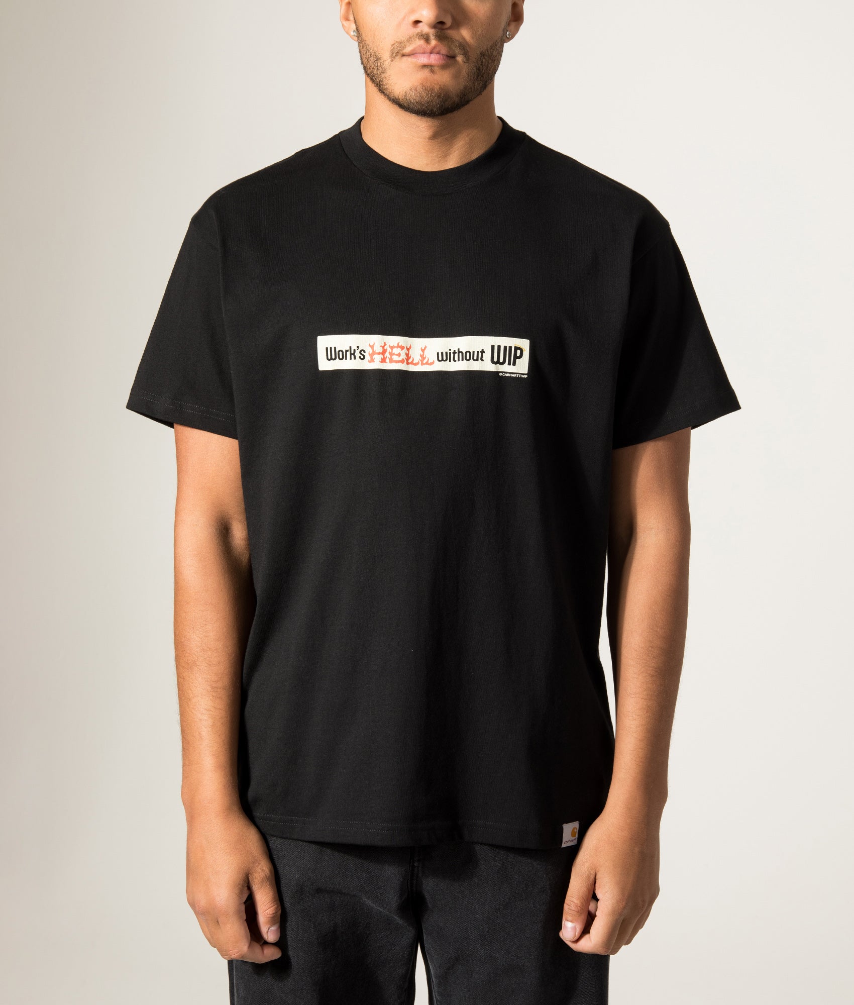 Carhartt WIP Loose Fit Bumper Stickers T-Shirt in Black at EQVVS Menswear. Model front shot.