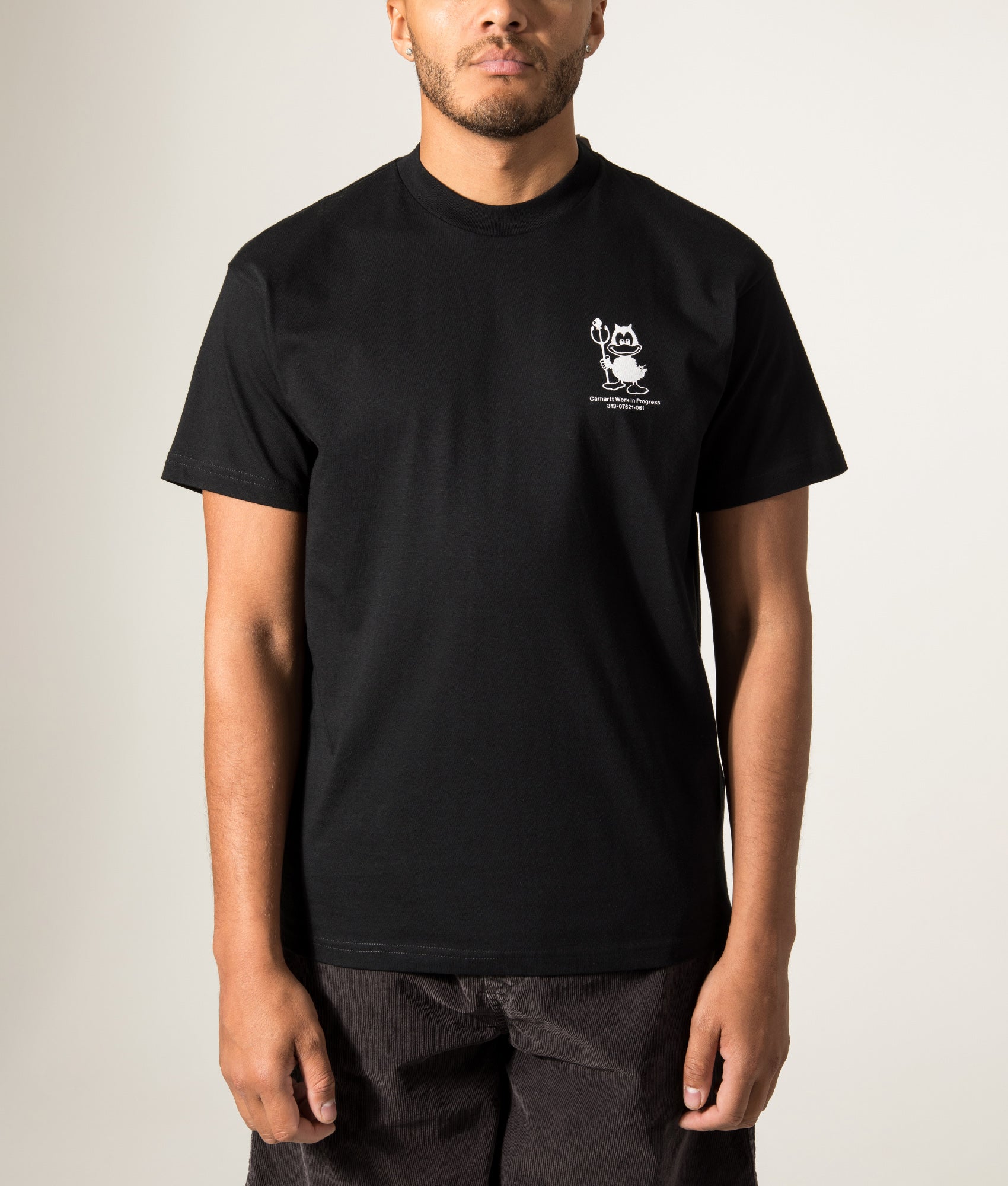 Carhartt WIP Loose Fit Bumper Car T-Shirt in Black at EQVVS Menswear. Model front shot.