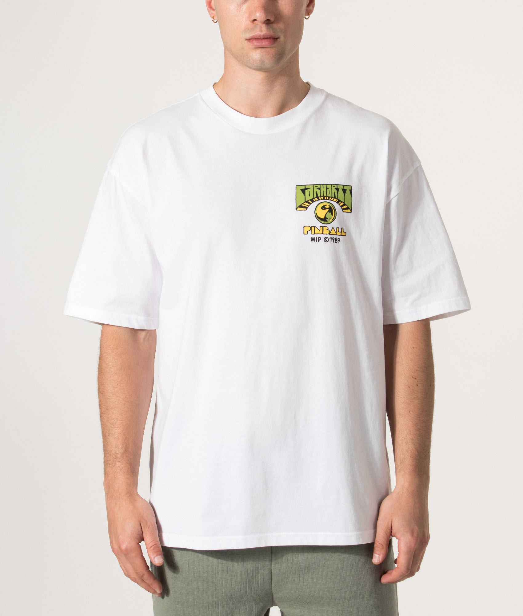 Carhartt WIP Oversized Fit Pinball T-Shirt in White at EQVVS Menswear. Model front shot.