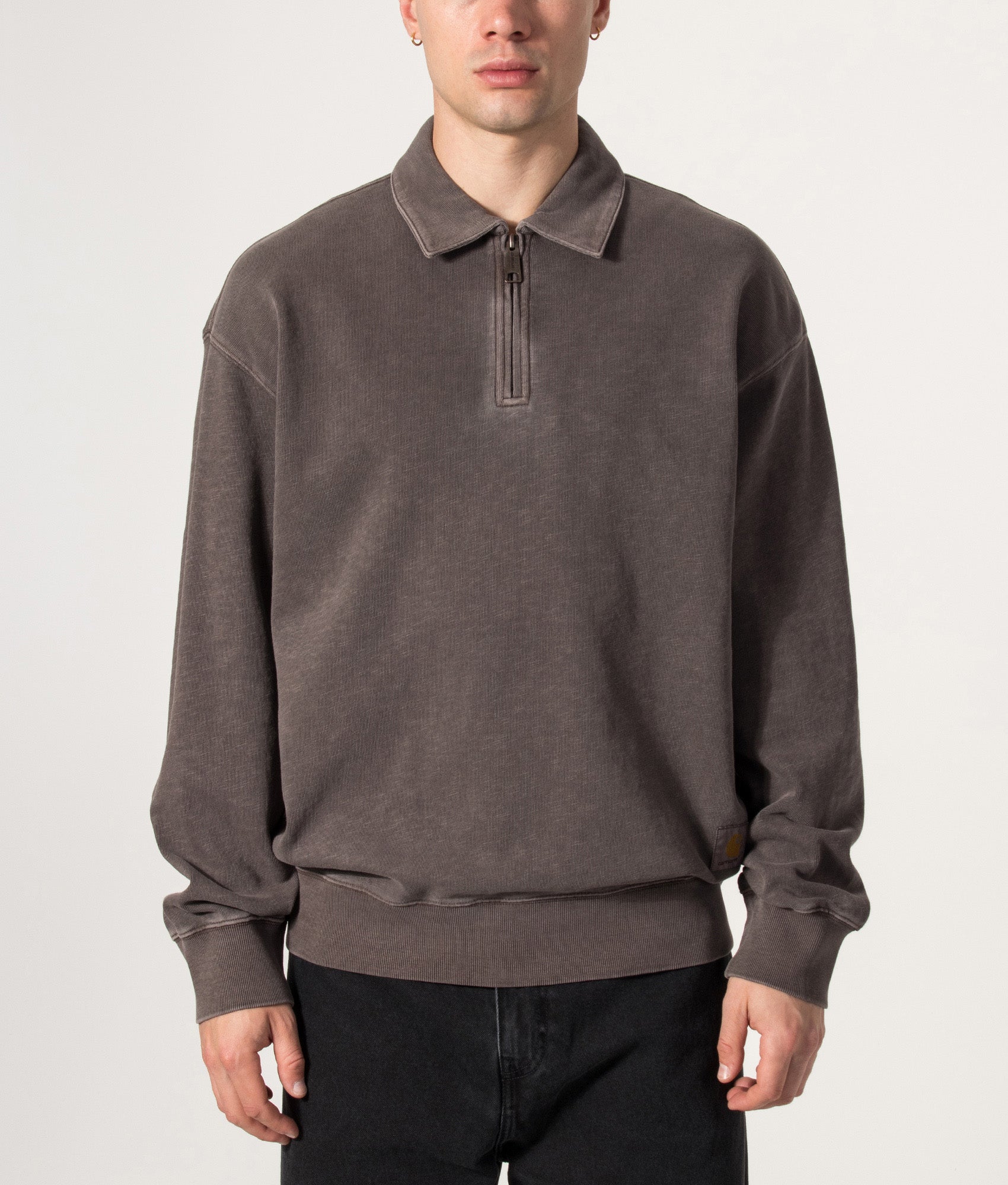 Carhartt WIP Balloon Fit Harper Quarter Zip Sweatshirt in Garment Dyed Tobacco at EQVVS Menswear. Model front shot.