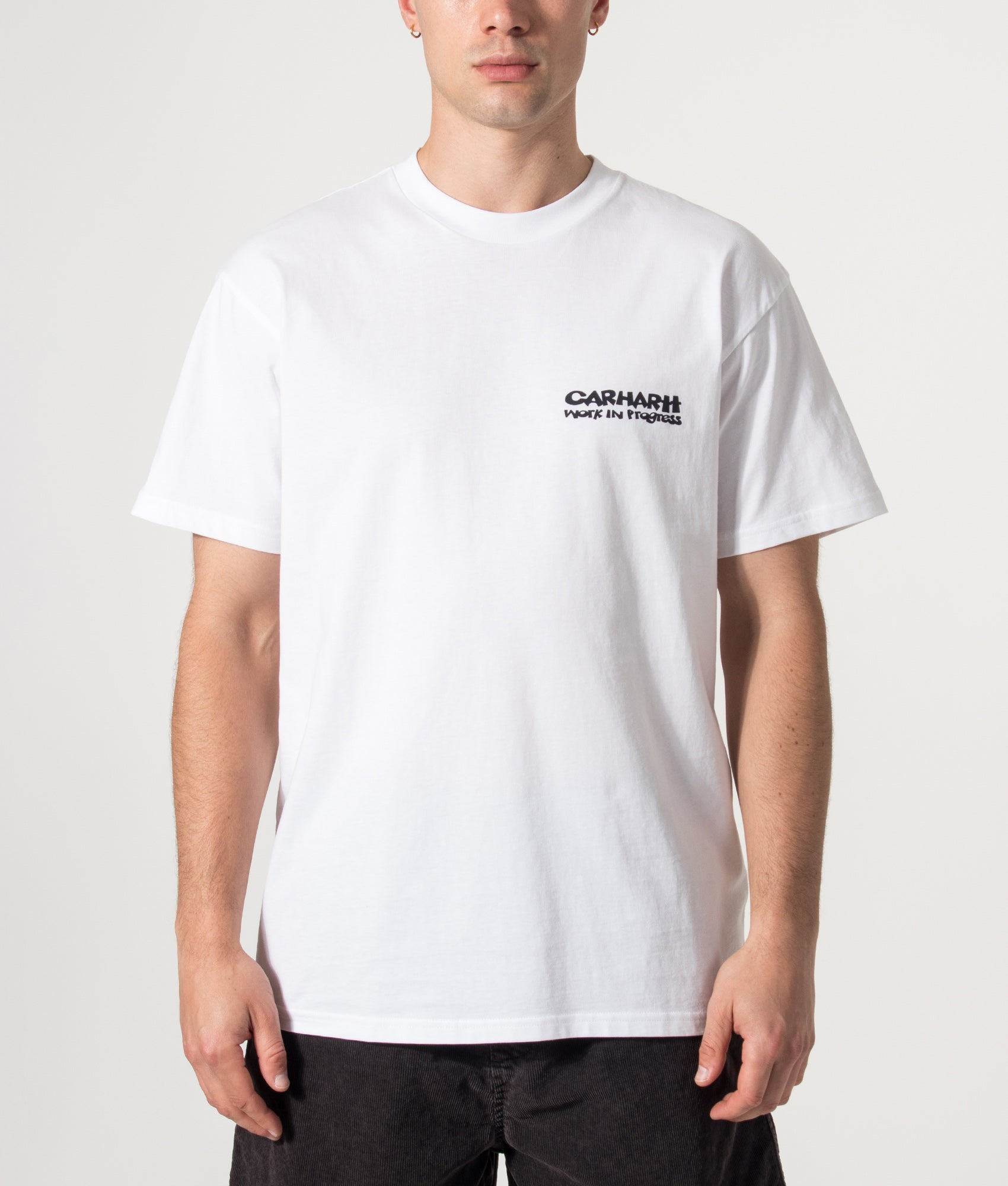 Carhartt WIP Loose Fit Cubist T-Shirt in White at EQVVS Menswear. Model front shot.