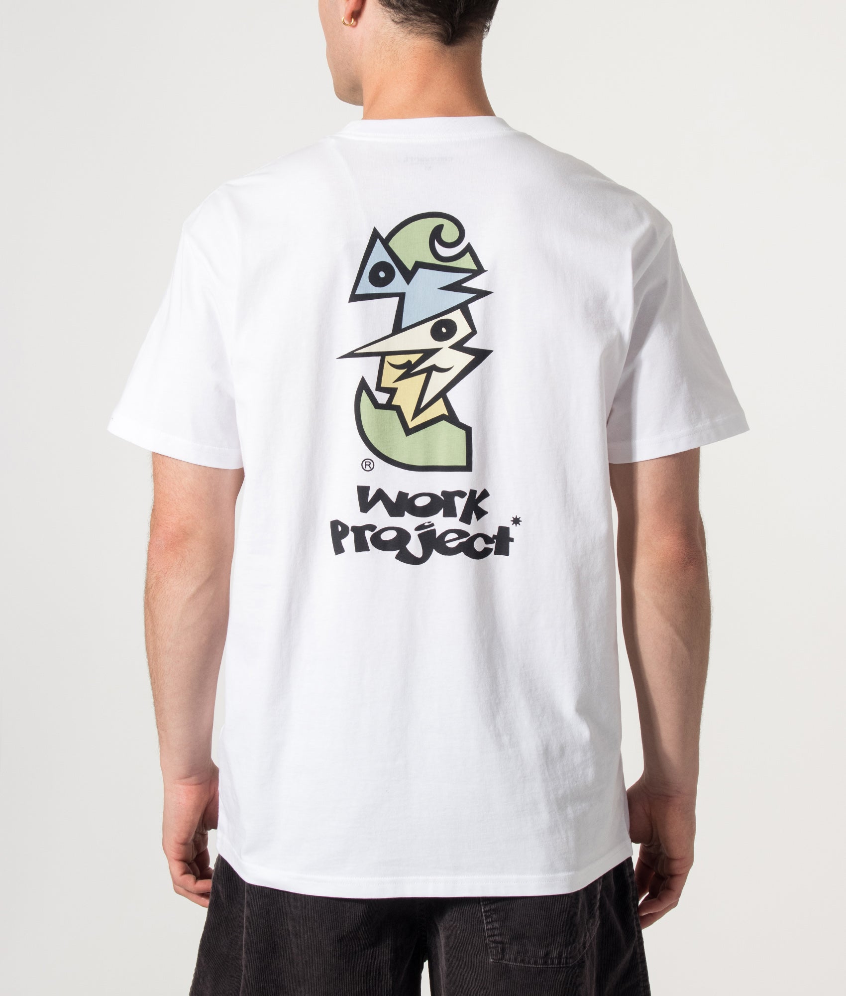 Carhartt WIP Loose Fit Cubist T-Shirt in White at EQVVS Menswear. Model back shot.