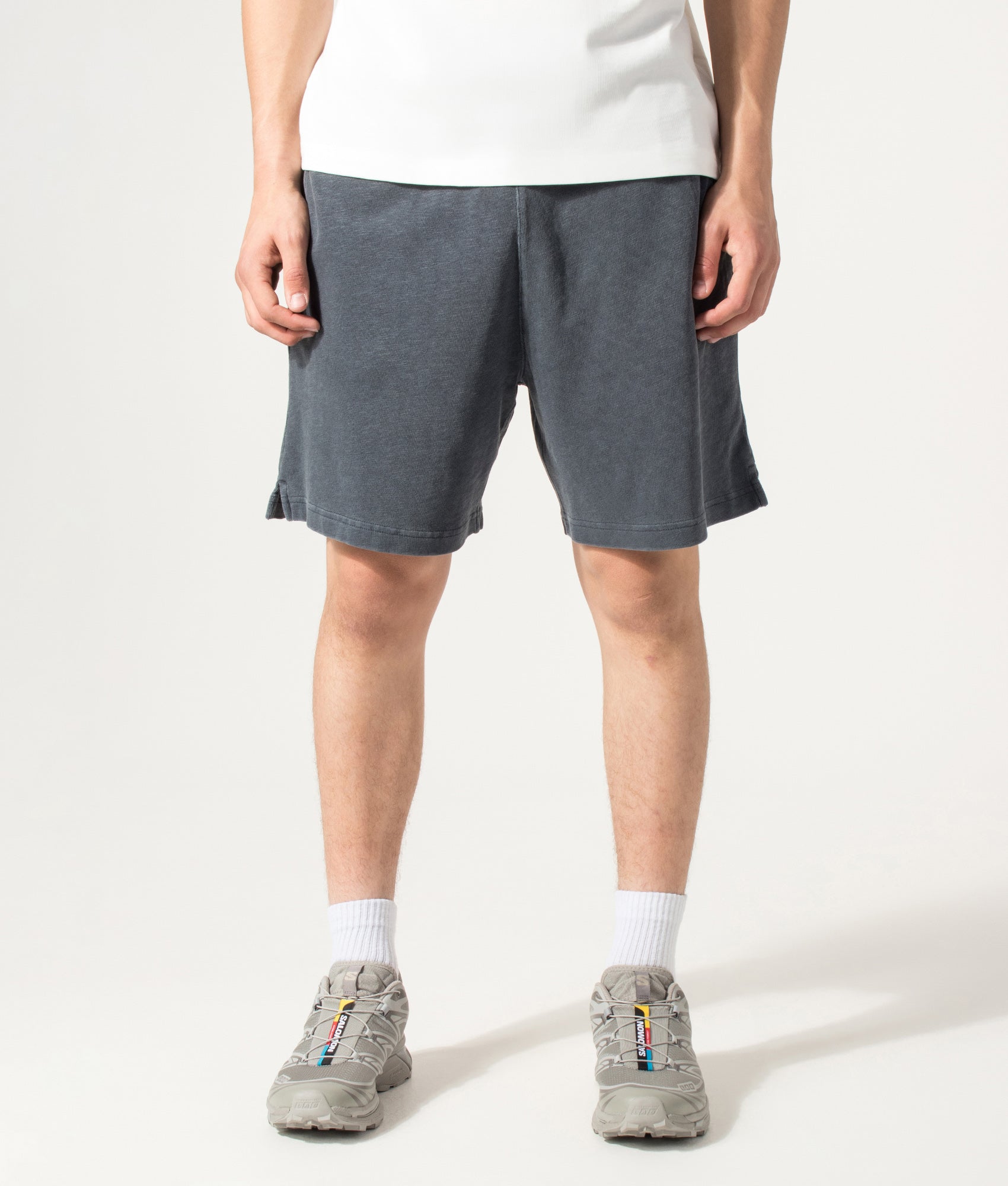 Carhartt WIP Balloon Fit Harper Sweat Shorts in Carbon at EQVVS Menswear. Model front shot.