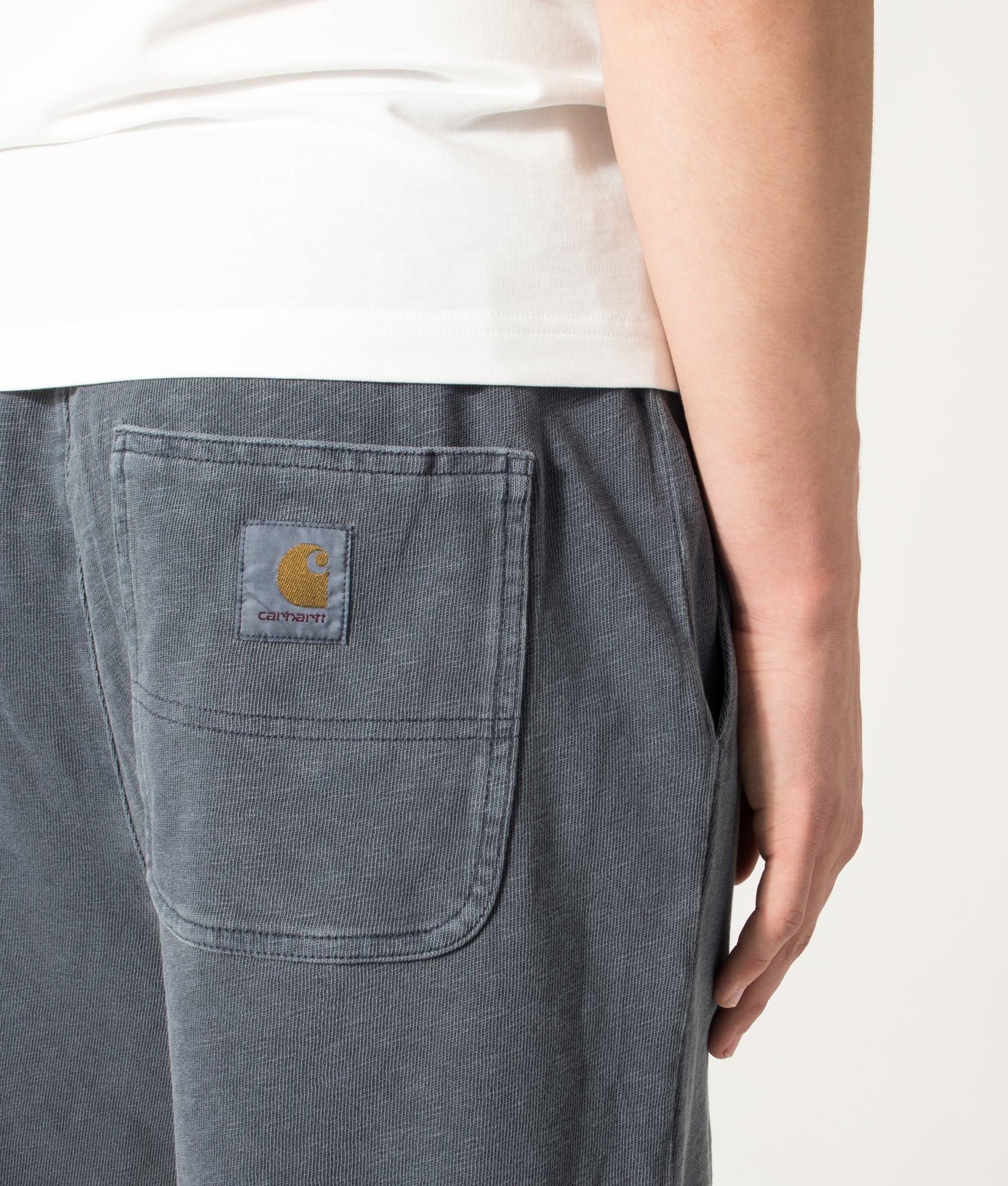 Carhartt WIP Balloon Fit Harper Sweat Shorts in Carbon at EQVVS Menswear. Back detail shot.