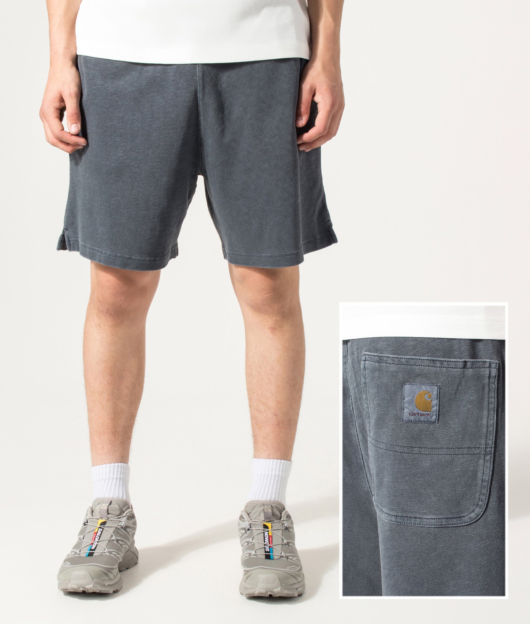 Carhartt WIP Balloon Fit Harper Sweat Shorts in Carbon at EQVVS Menswear. Model front and back detail shot.