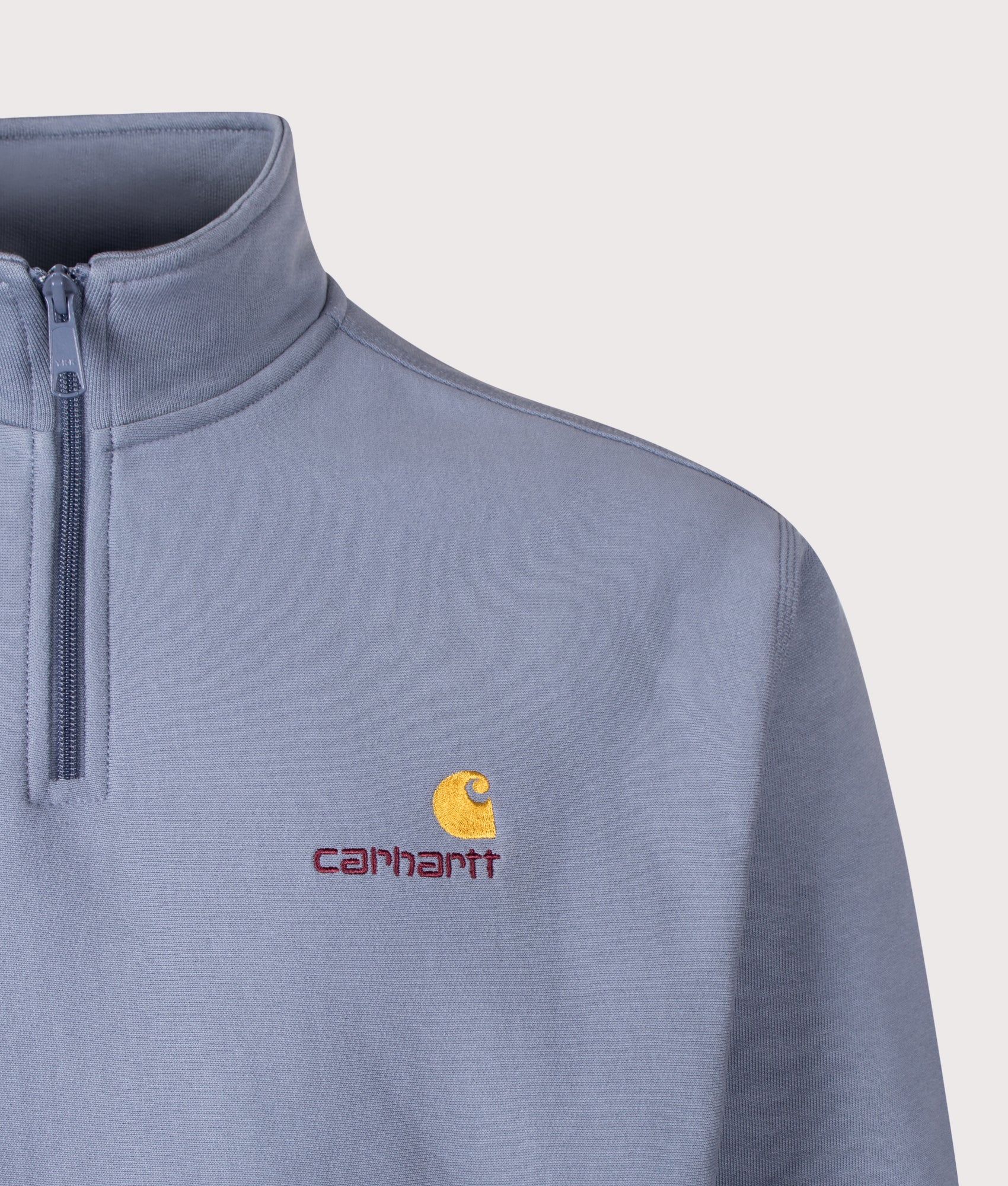 Carhartt WIP Loose Fit Quarter Zip American Script Sweatshirt in Shady Blue at EQVVS Menswear. Detail shot.