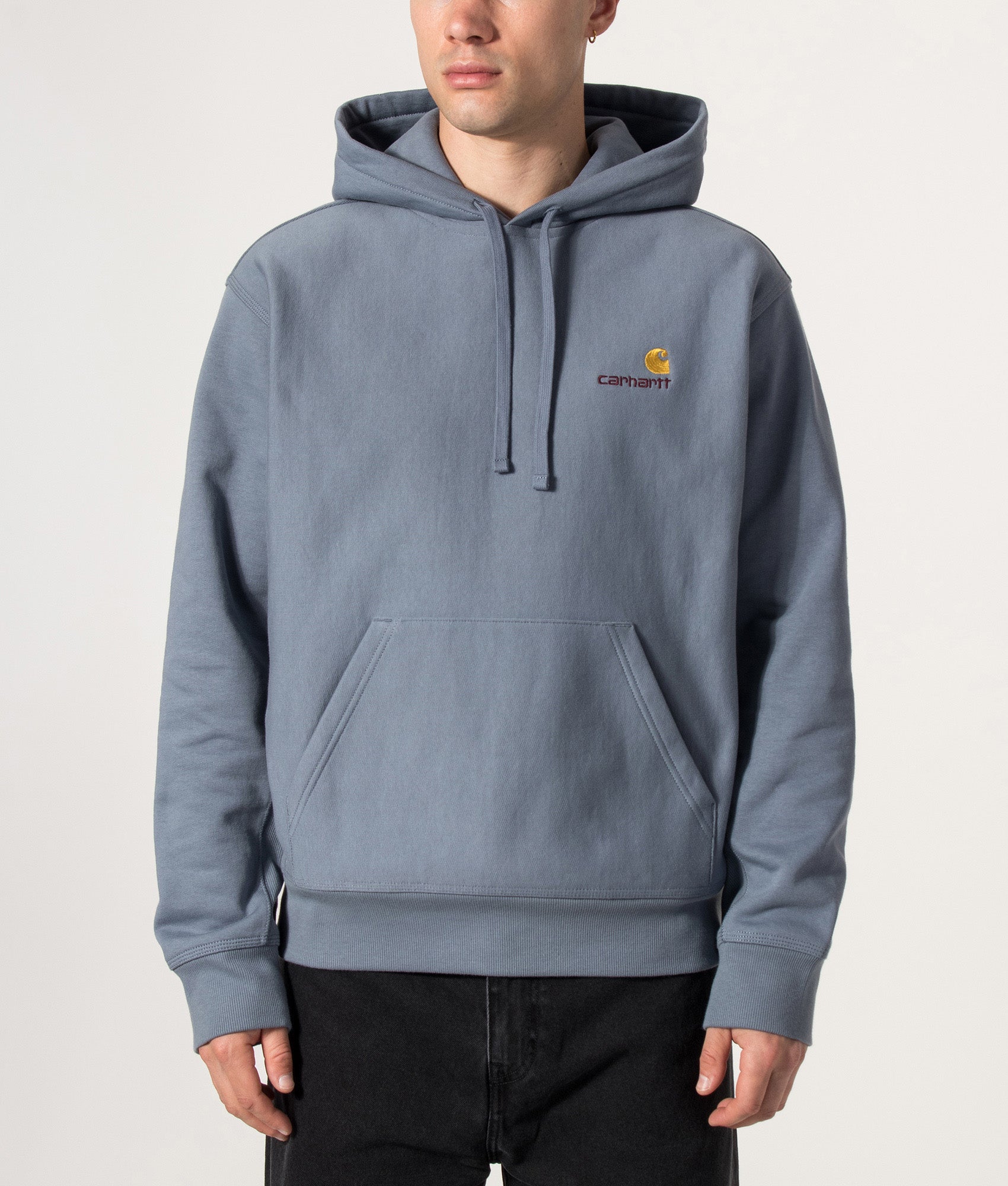 Carhartt WIP Loose Fit American Script Hoodie in Shady Blue at EQVVS Menswear. Model front shot.