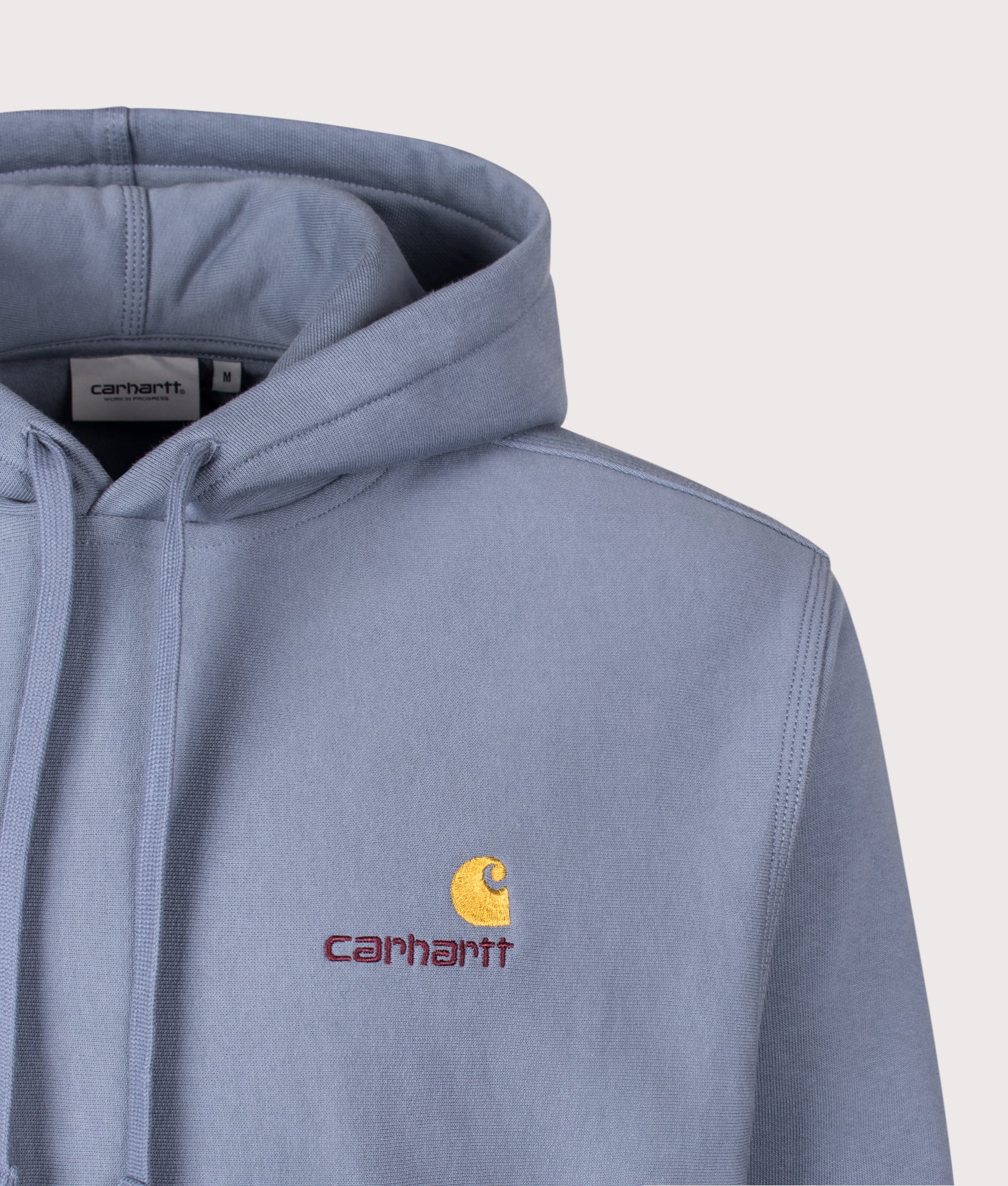 Carhartt WIP Loose Fit American Script Hoodie in Shady Blue at EQVVS Menswear. Detail shot.