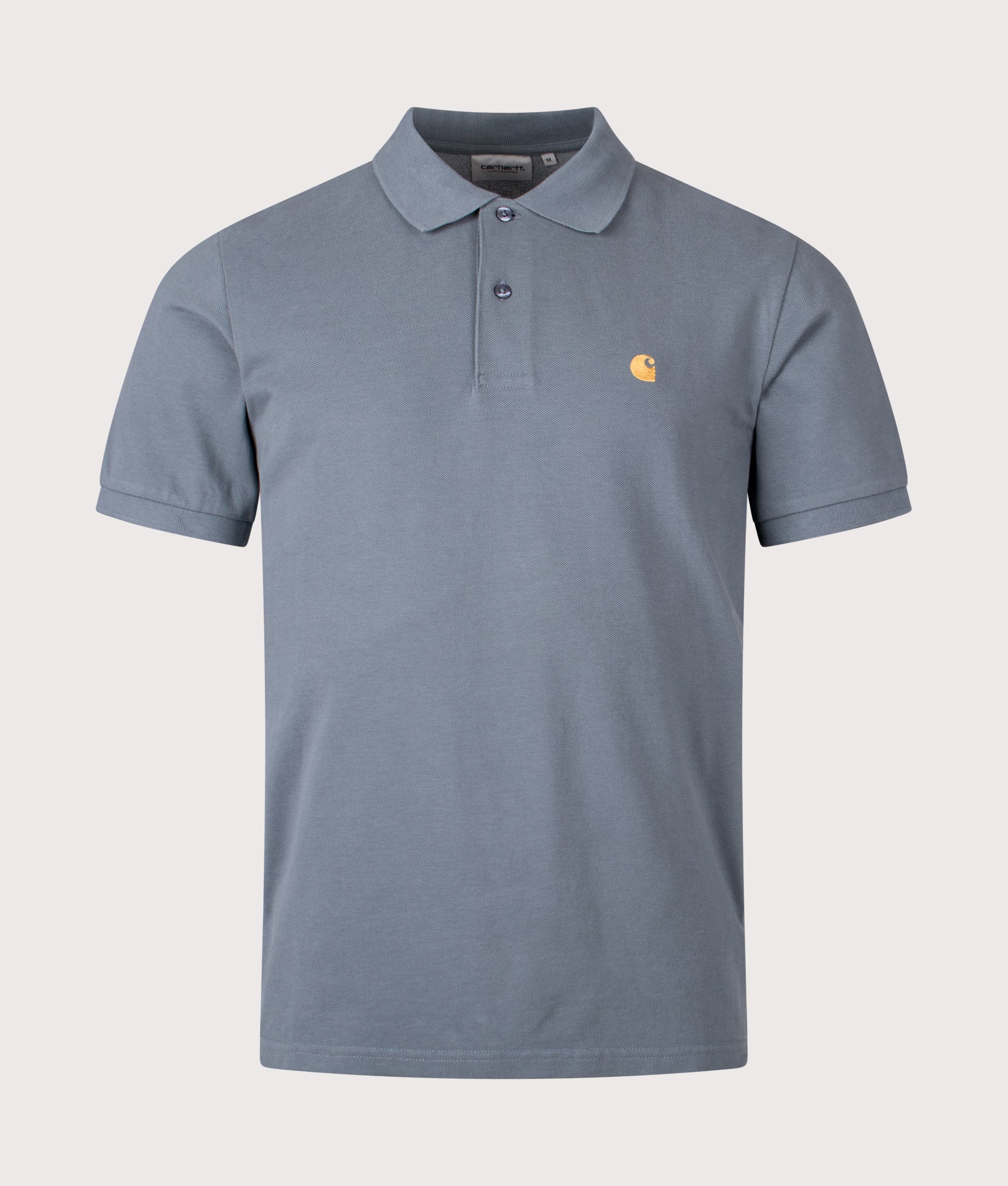 Carhartt WIP Relaxed Fit Chase Pique Polo Shirt in Cozy Blue and Gold at EQVVS Menswear. Front shot.