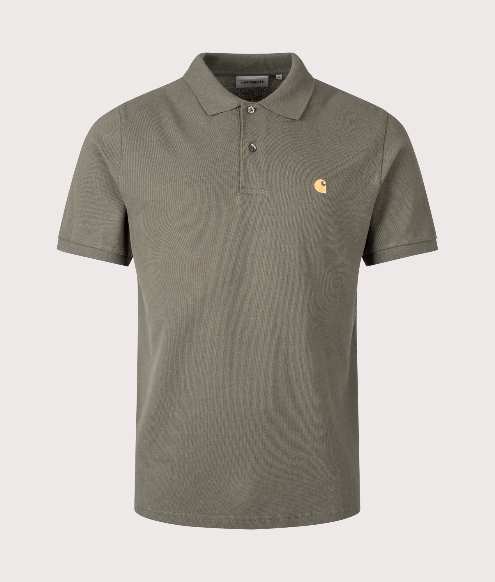Carhartt WIP Relaxed Fit Chase Pique Polo Shirt in Leaf and Gold at EQVVS Menswear. Front shot.