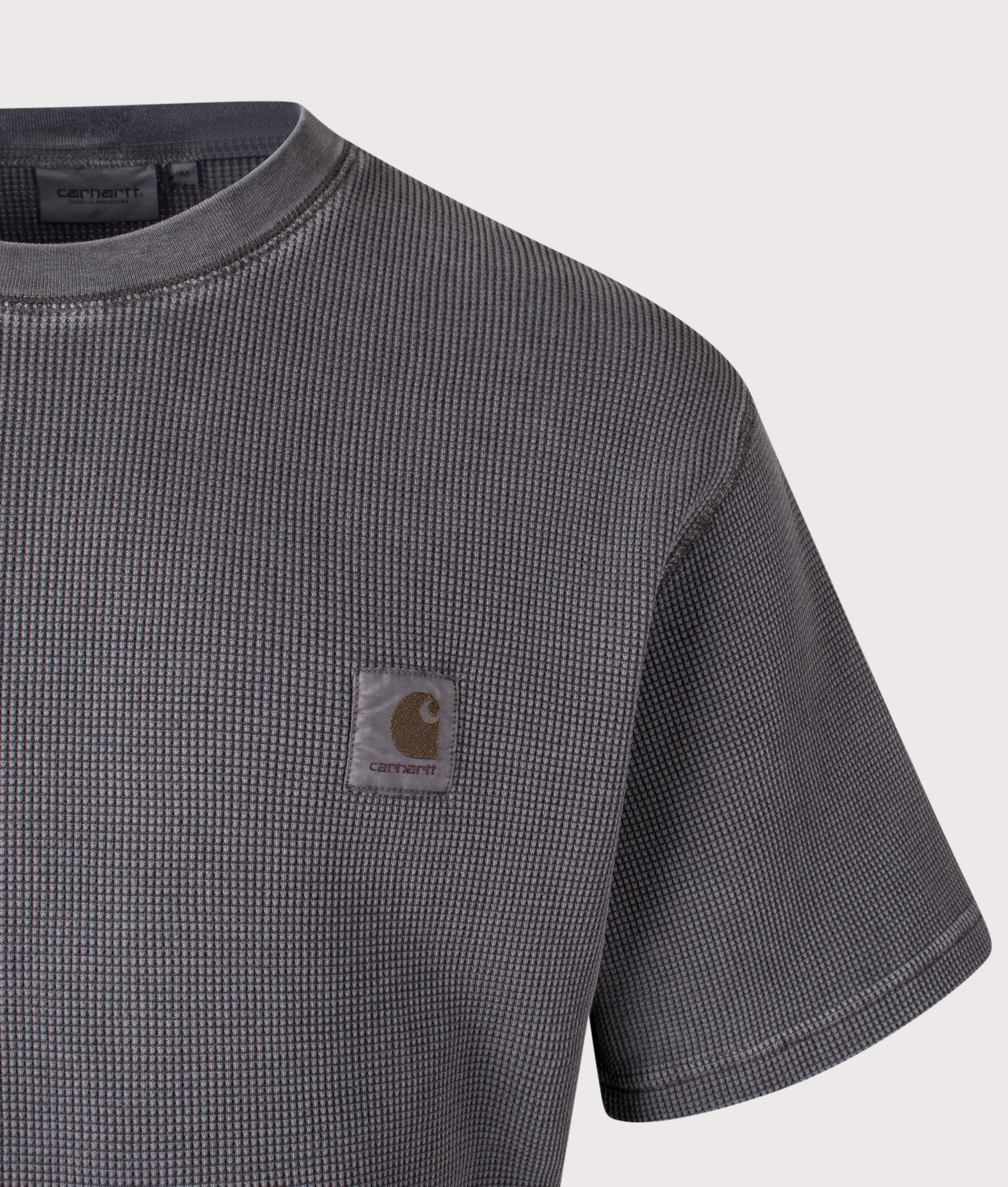 Carhartt WIP Relaxed Fit Nelson Waffle T-Shirt in Black at EQVVS Menswear. Detail shot.