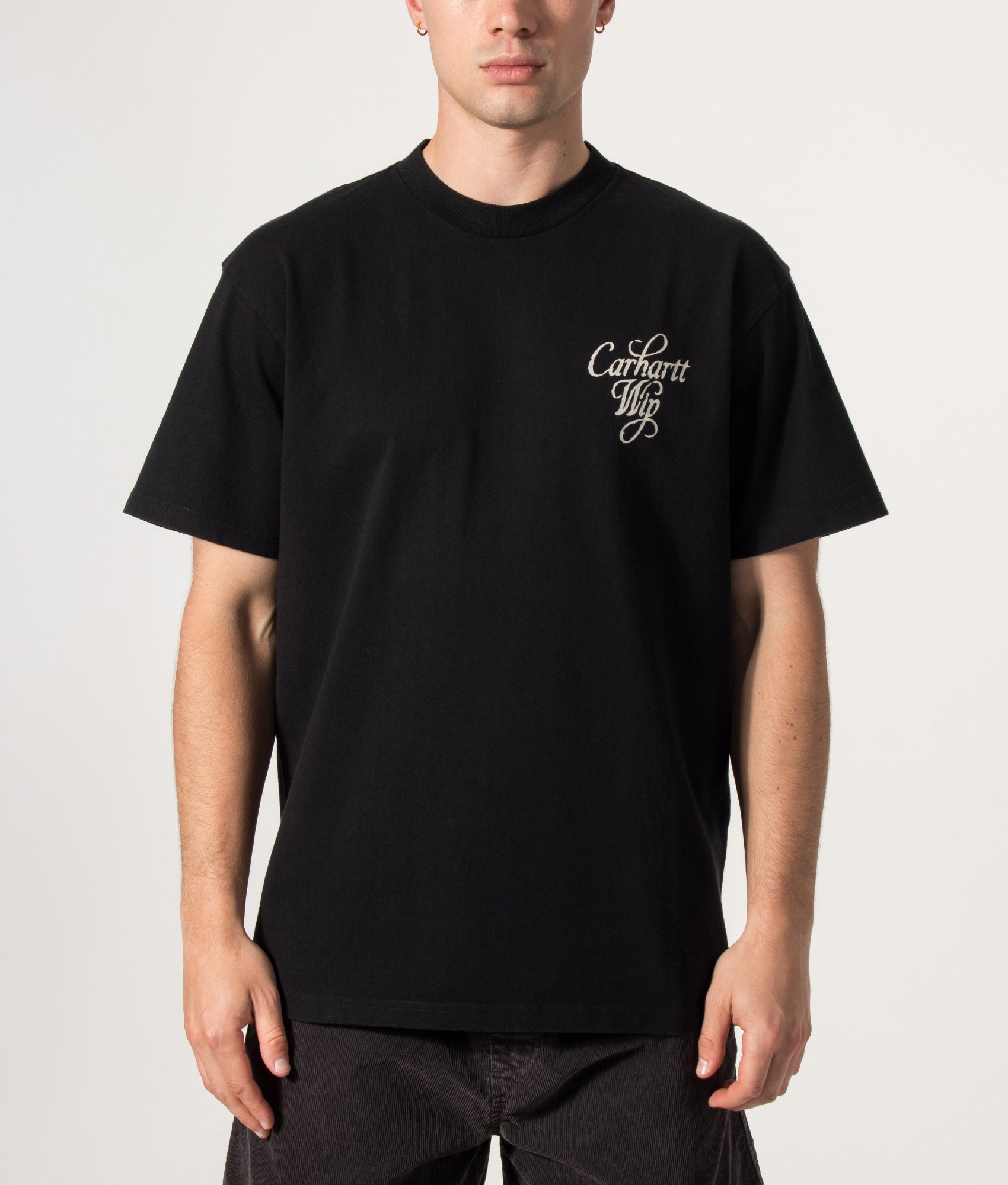 Carhartt WIP Loose Fit Vestige T-Shirt in Black at EQVVS Menswear. Model front shot.