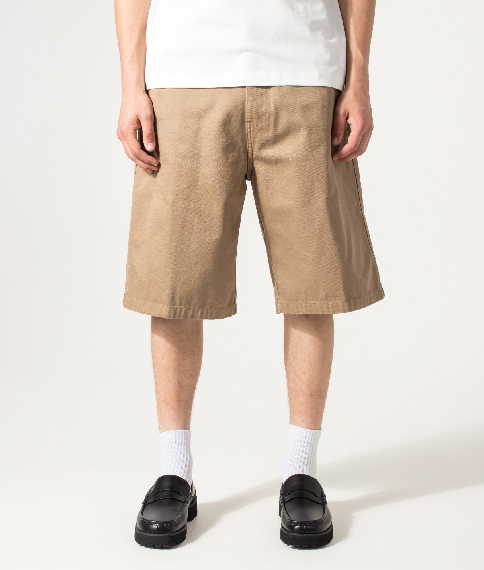 Carhartt WIP Loose Fit Brader Shorts in Rinsed Leather at EQVVS Menswear. Model front shot.