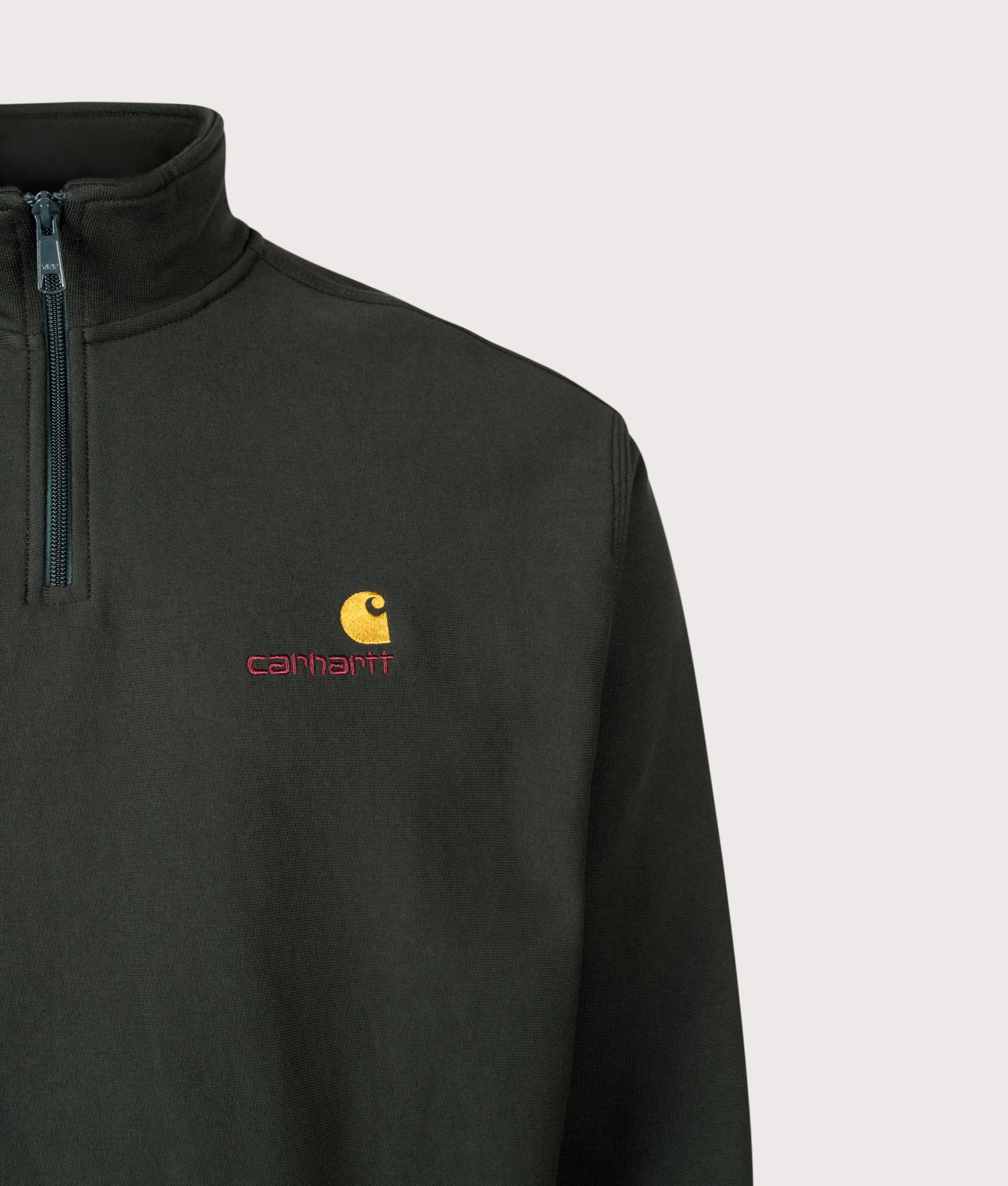 Carhartt WIP Loose Fit Quarter Zip American Script Sweatshirt in Raven at EQVVS Menswear. Detail shot.