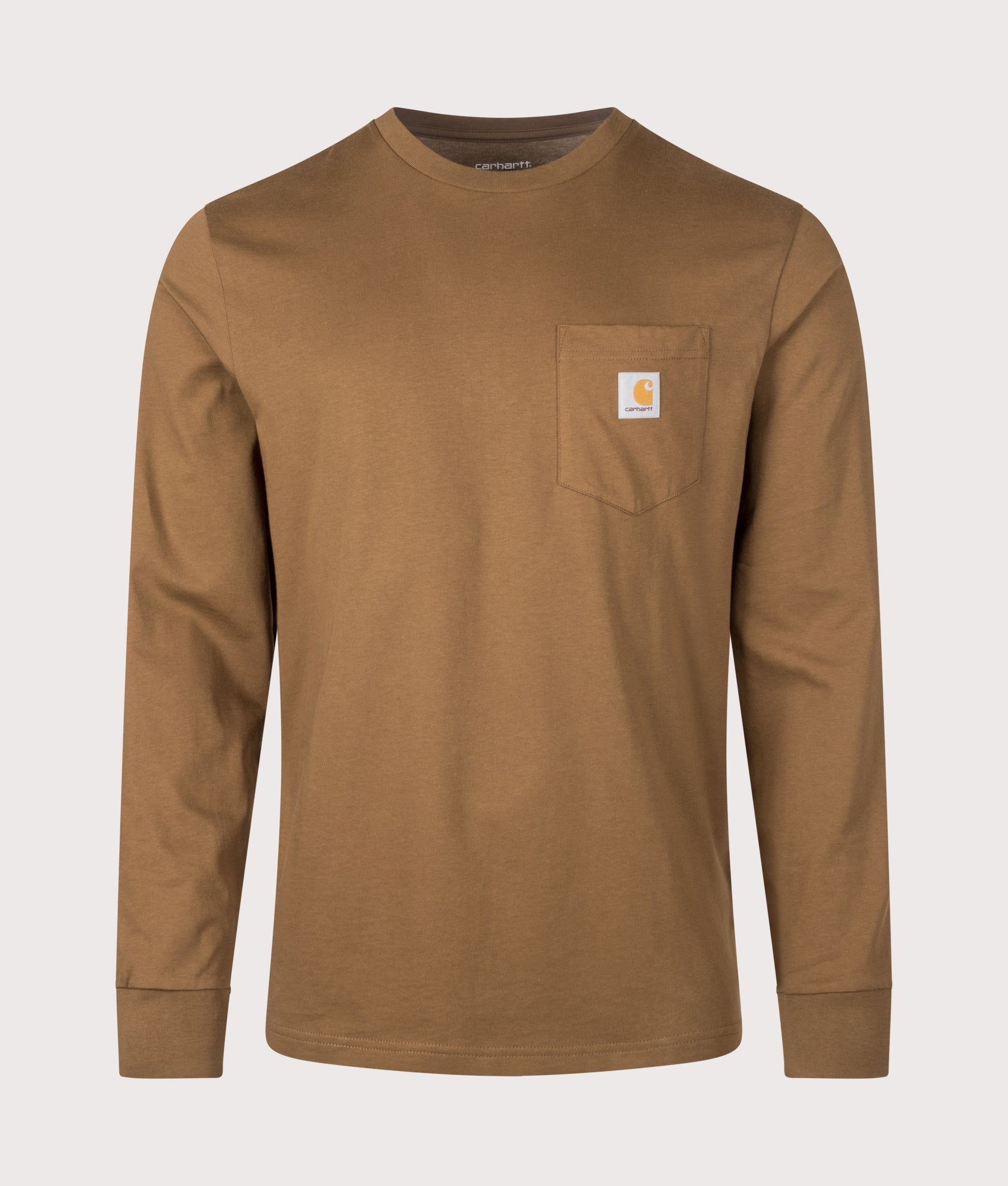 Carhartt WIP Regular Fit Long Sleeve Pocket T-Shirt in WIP Hamilton Brown at EQVVS Menswear. Front shot.