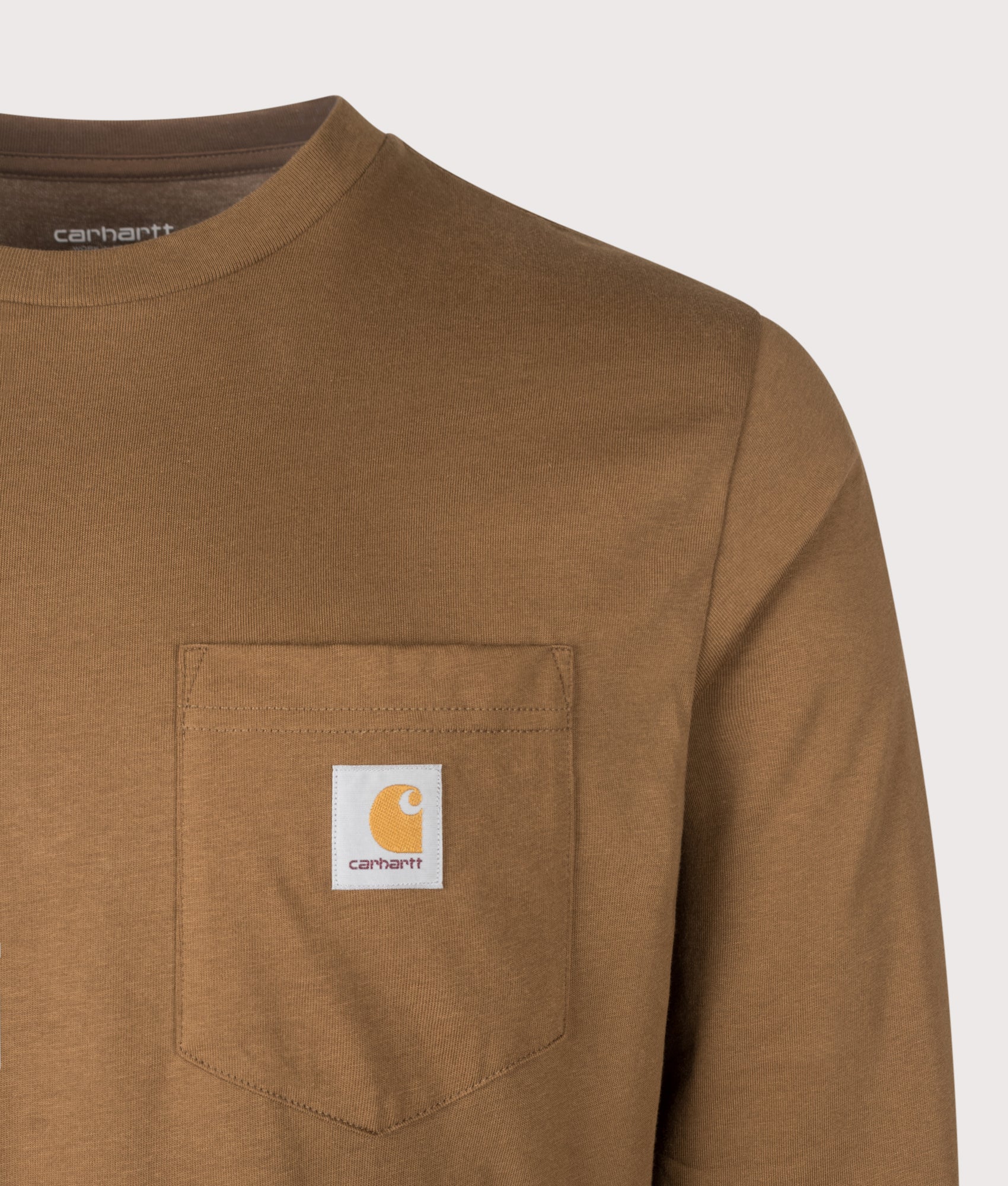 Carhartt WIP Regular Fit Long Sleeve Pocket T-Shirt in WIP Hamilton Brown at EQVVS Menswear. Detail shot.